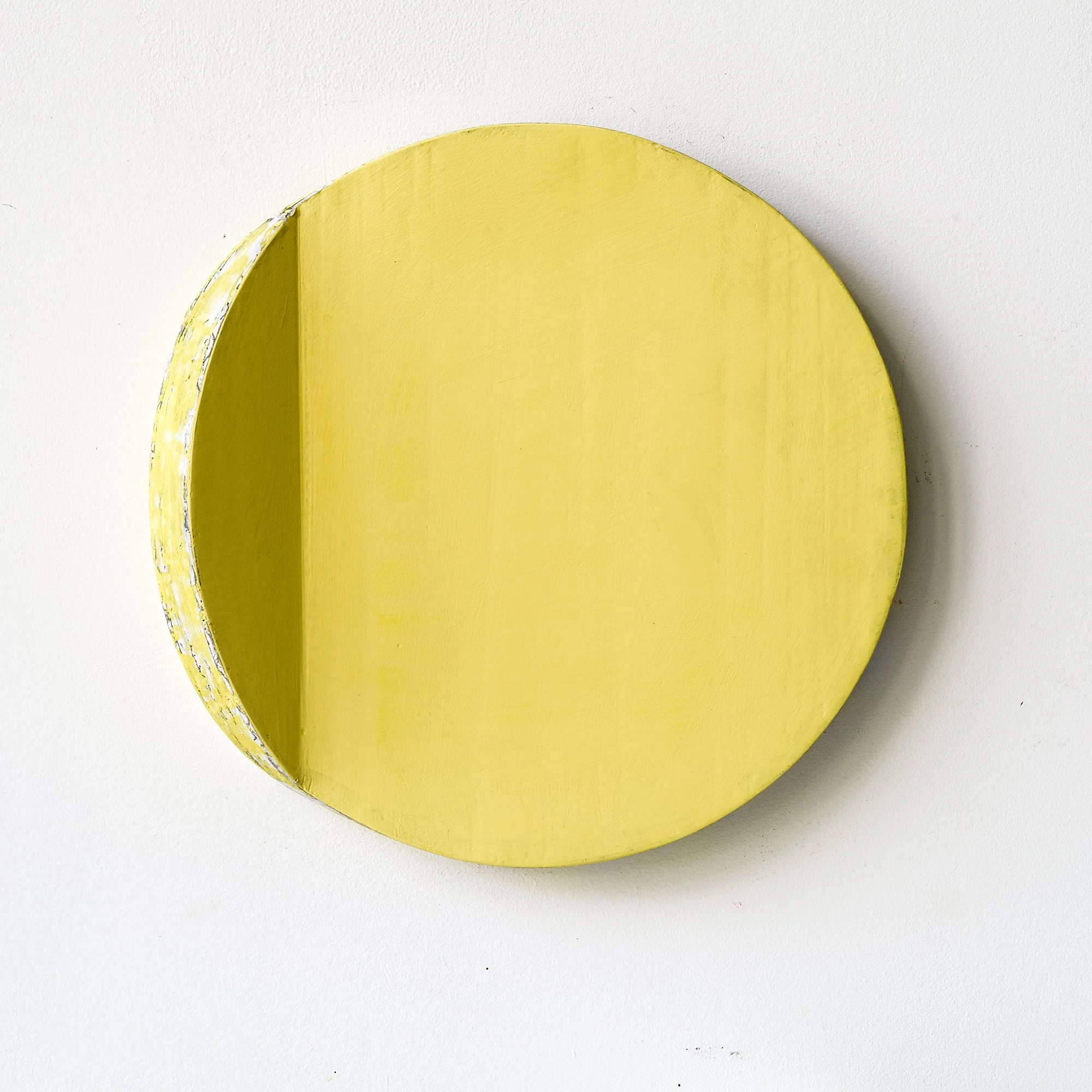 SOLD

Yellow textured circular wooden object with a flat edge against a white background.