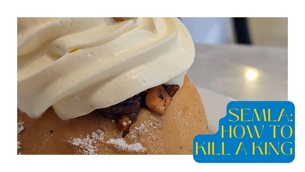  Close-up of a  semla , a Swedish dessert made of a cardamom bun, cut in two and filled with almond paste and topped with whipped cream. 