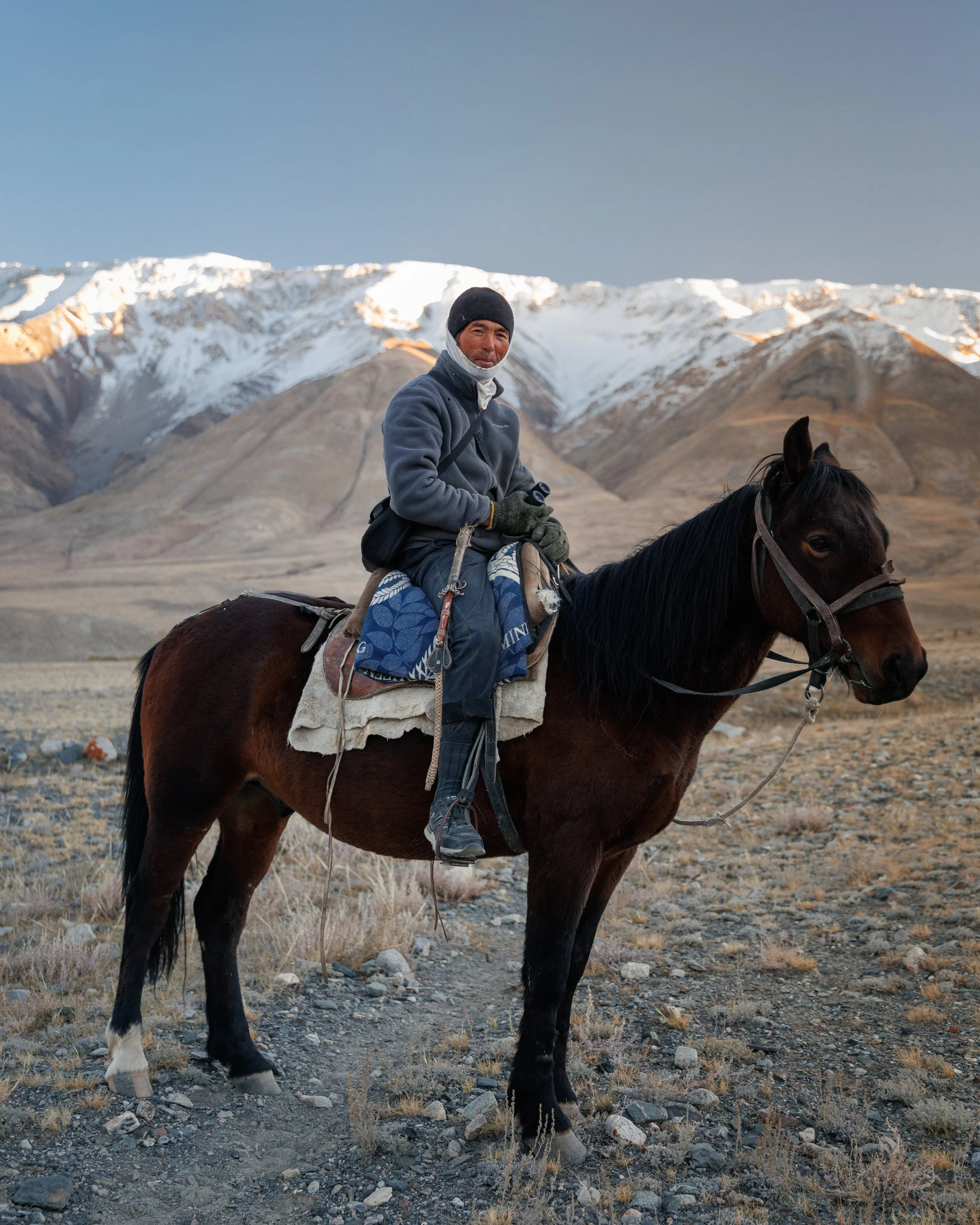 Team searching for snow leopards on a snow leopard photography tour