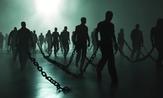 A drawing of people walking in chains