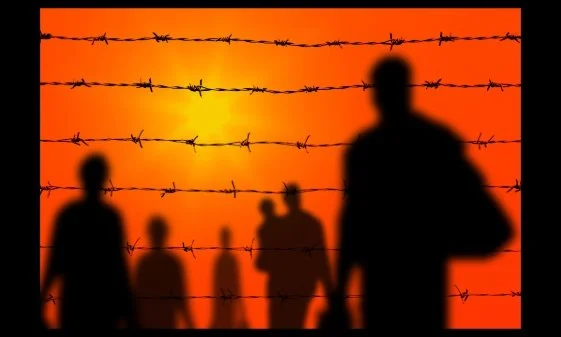 Civilians, shown in silhouettes and through barbed wires, fleeing, against a sky turned red.