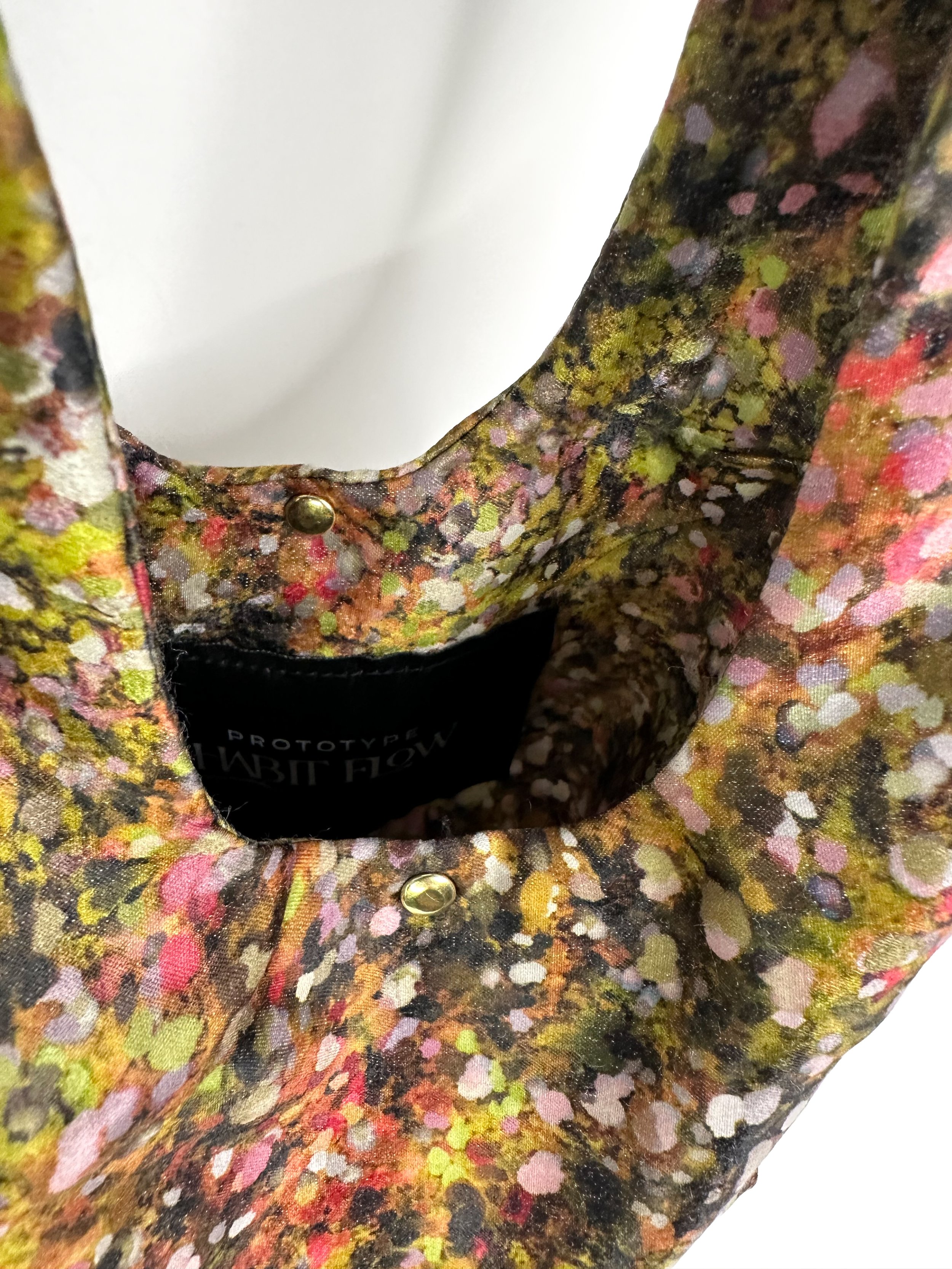 Detail view of Abstract garden print fairy bag in green and brown with gold rivets hand sewn by Habit Flow