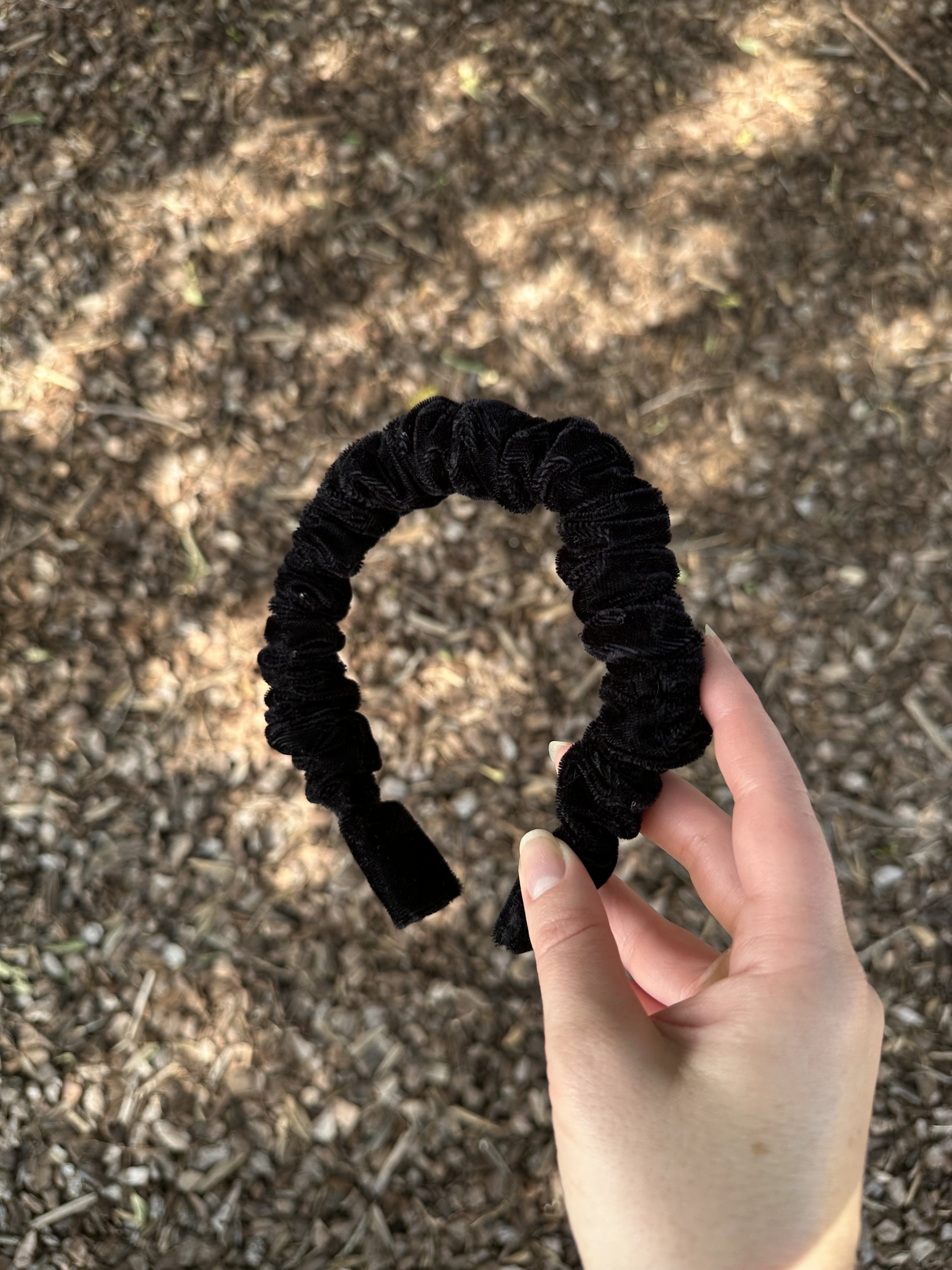 Classic black velvet headband with a luxury winter vibe