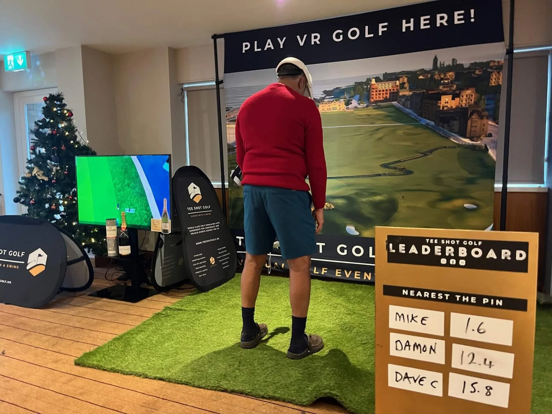 Man playing VR golf at golf resort.