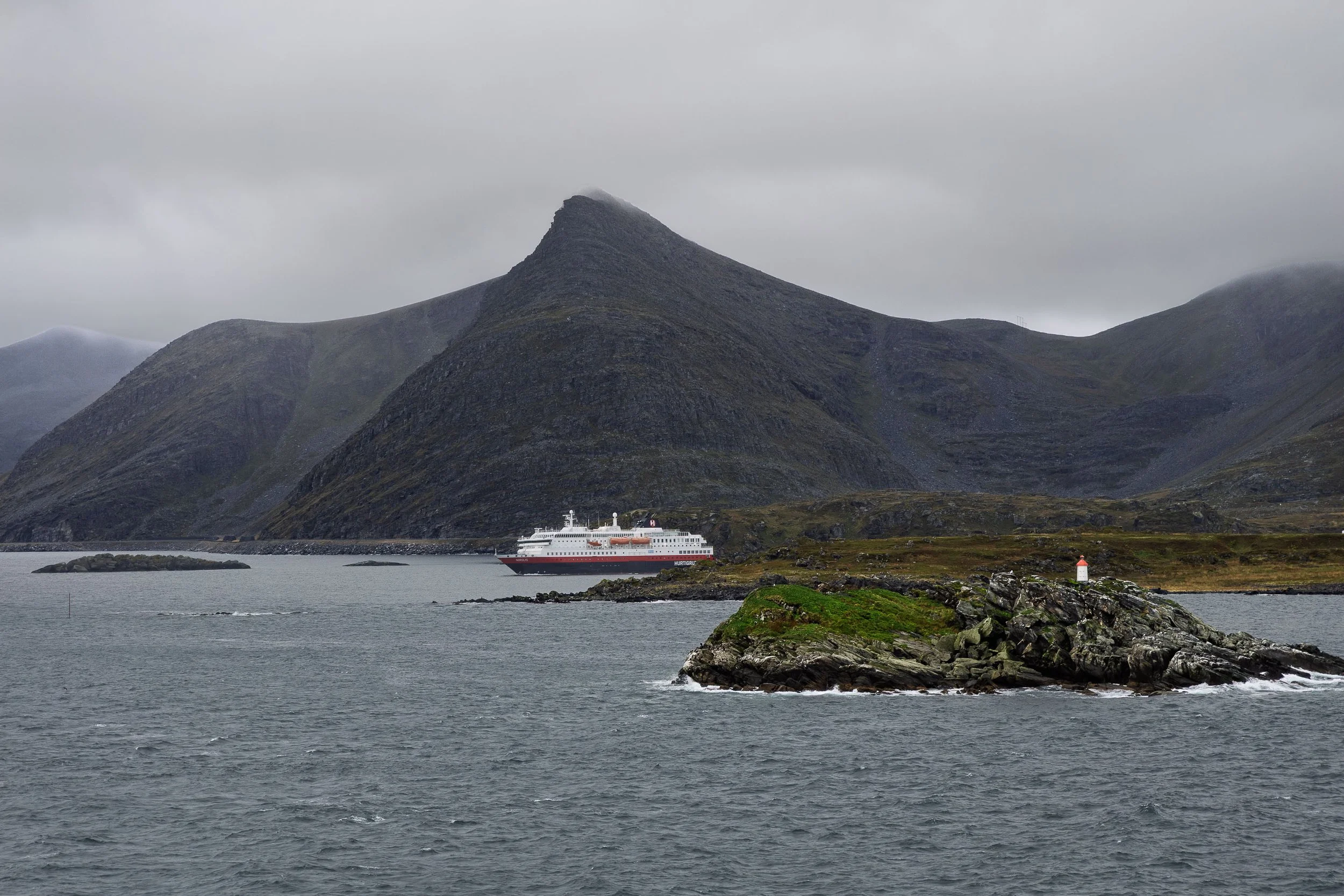 A Hurtigruten Ship Emerging From a Hidden Bay
