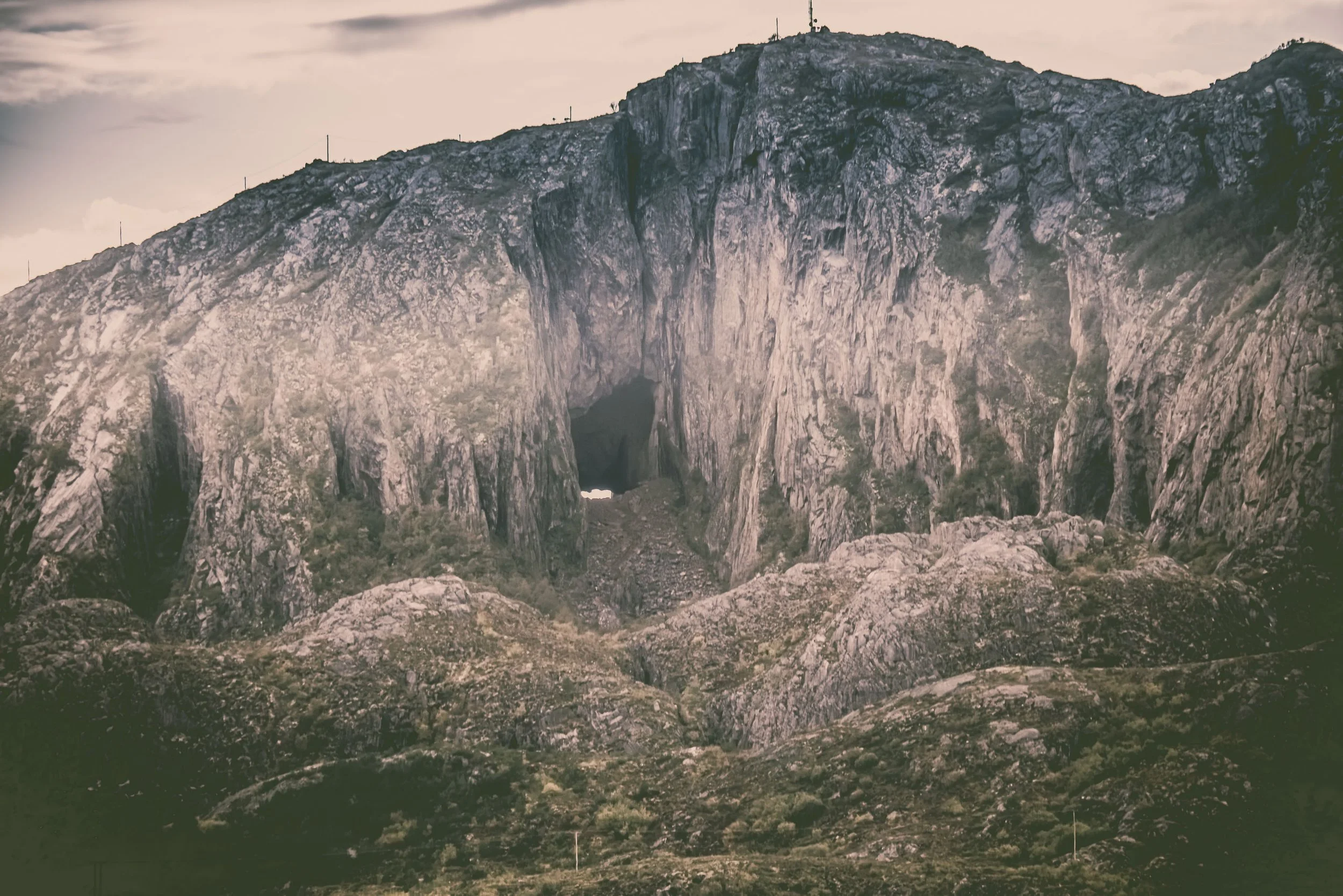 First Peek of the Hole in Torghatten in Sepia