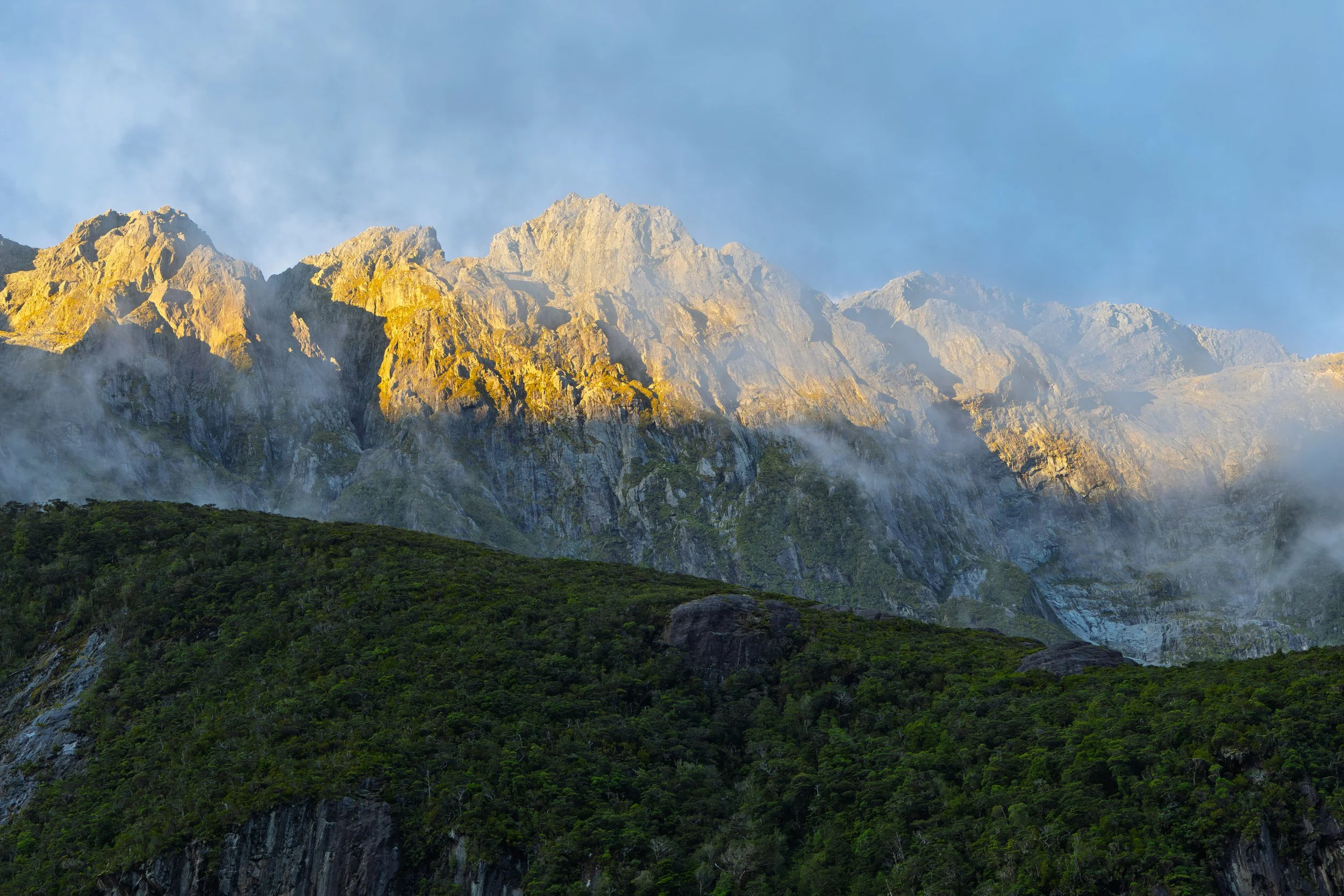 Sun along the peaks in Milford Sound
