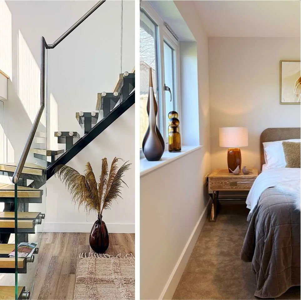 A structural stairway is softened Sith textured rug and a vase with large grasses.  Curvy brown glass bottles decorate the window ledge and russet table lamp is on a white washed wood side table