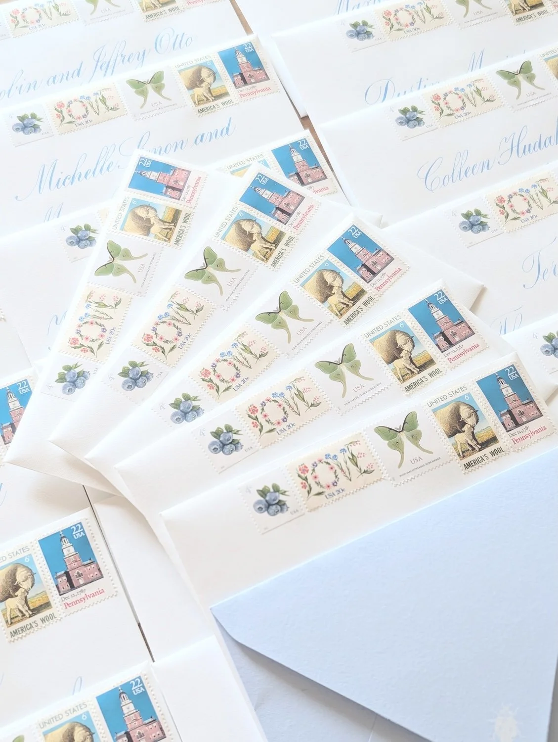 Just mailed out these beauties this morning.

For E&amp;T's invitation suite, we paired hand-addressed calligraphy with a carefully curated collection of vintage postage. Every stamp was intentionally selected to reflect pieces of their story, creati