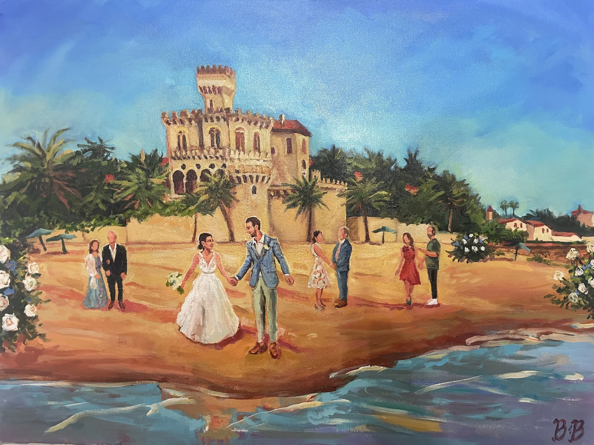Live wedding painting of a bride and groom walking along the beach in front of a historic castle venue Forte da Cruz in Estoril Portugal, surrounded by wedding guests and ocean views, painted onsite by Bloom & Bliss Art