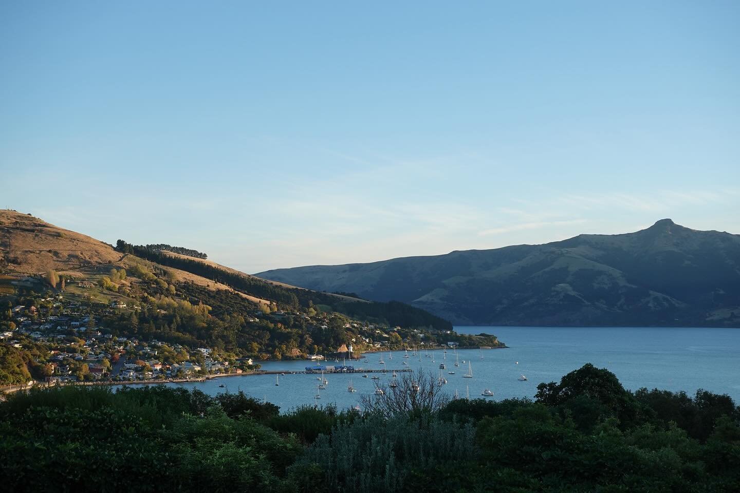 After flying into Christchurch and picking up our campervan, we headed 1.5 hours to Akaroa, a coastal and historically French little town. We were able to walk down a short trail from our campsite right onto their Main Street.

Here you can see the r