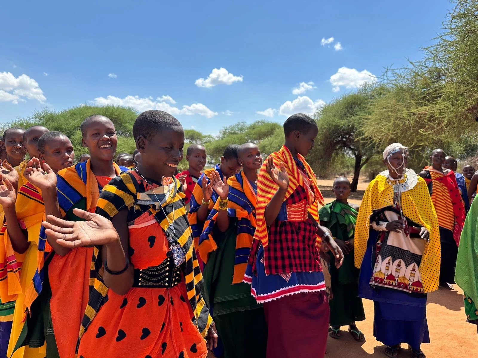 The Endumo community welcoming us with singing and dancing