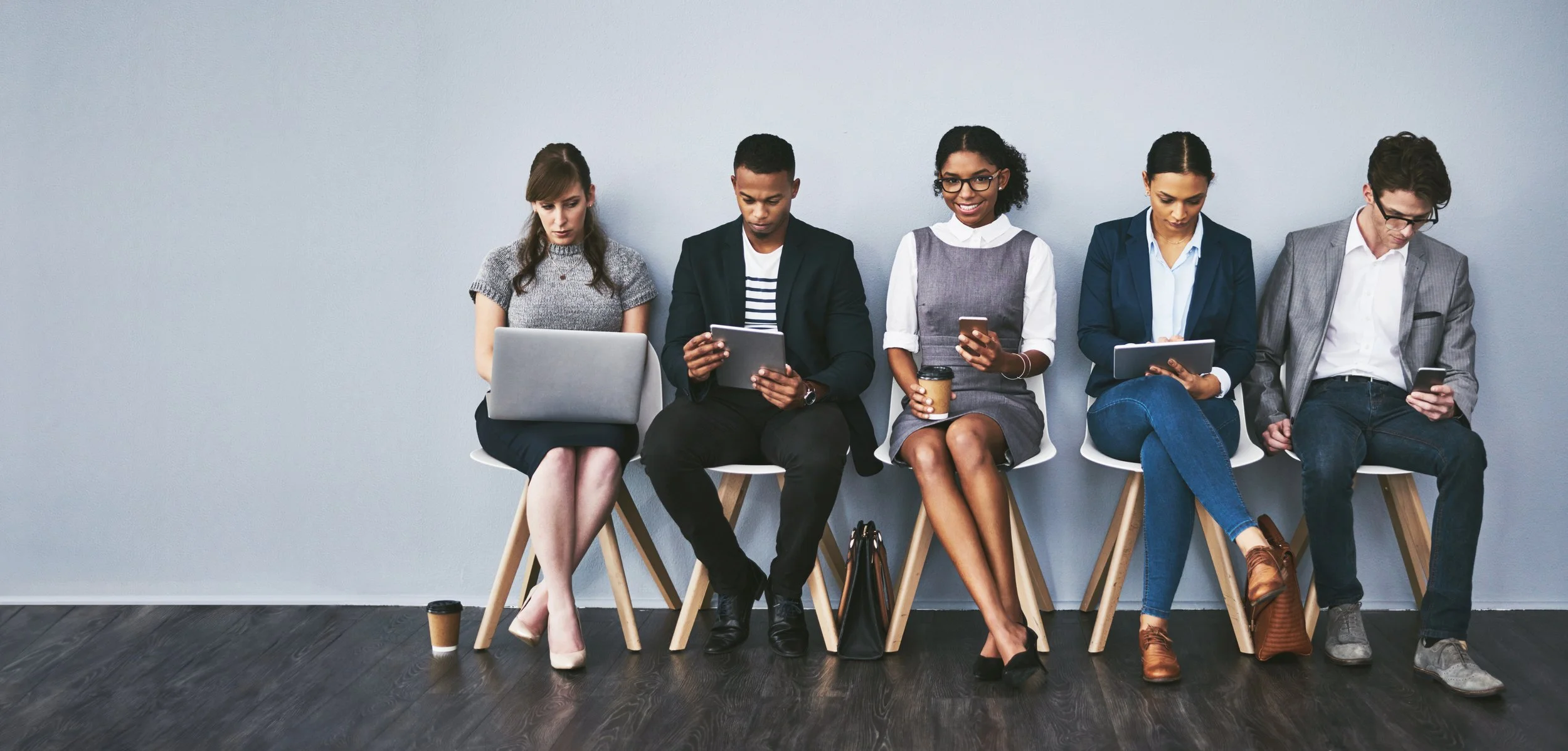 these-seats-are-those-shortlist-full-length-shot-group-young-businesspeople-waiting-line-their-interviews.jpg