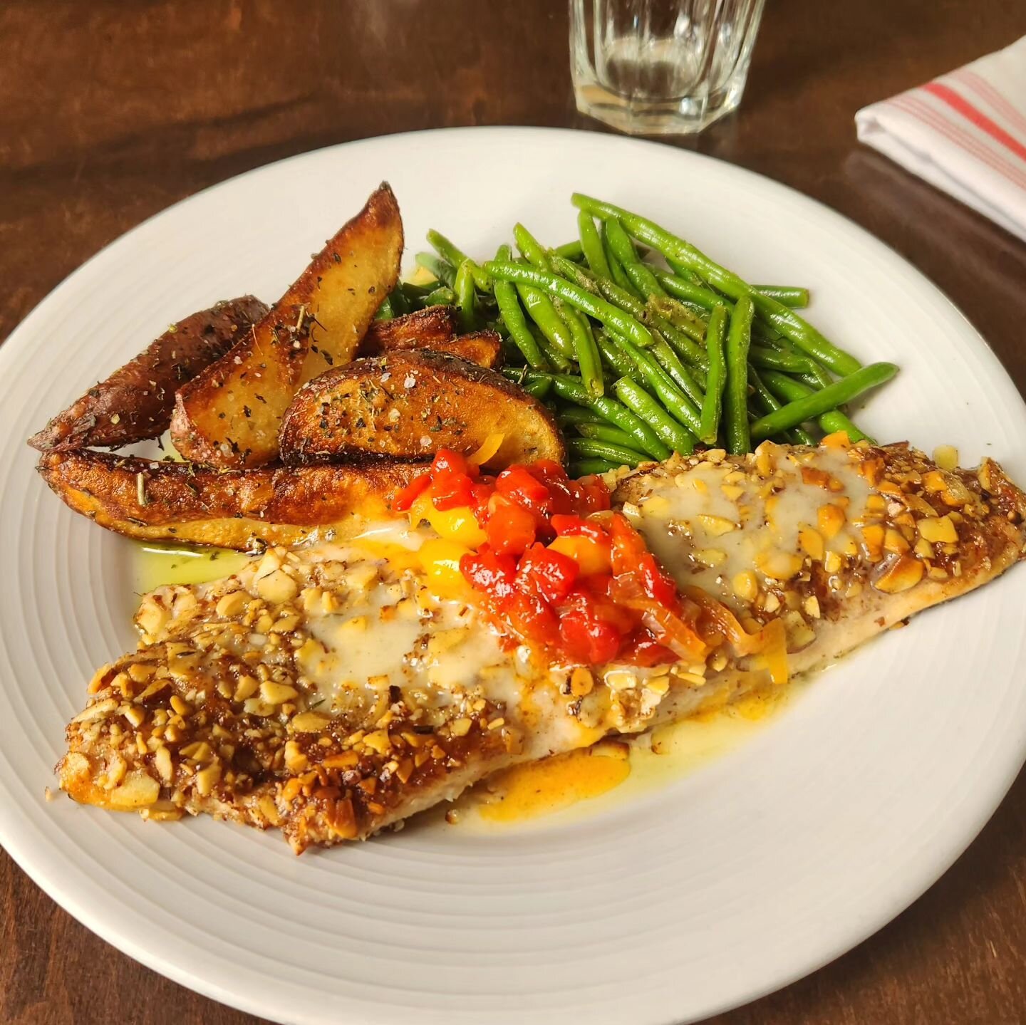 Truite aux Amandes - almond-crusted trout from @sunbursttrout with piperade, haricots verts, roasted potatoes, and brown butter

The weather is giving us all the feels for this dish tonight. Come on by for yours!!
.
.
.
#avlrendezvous #avleats #trout