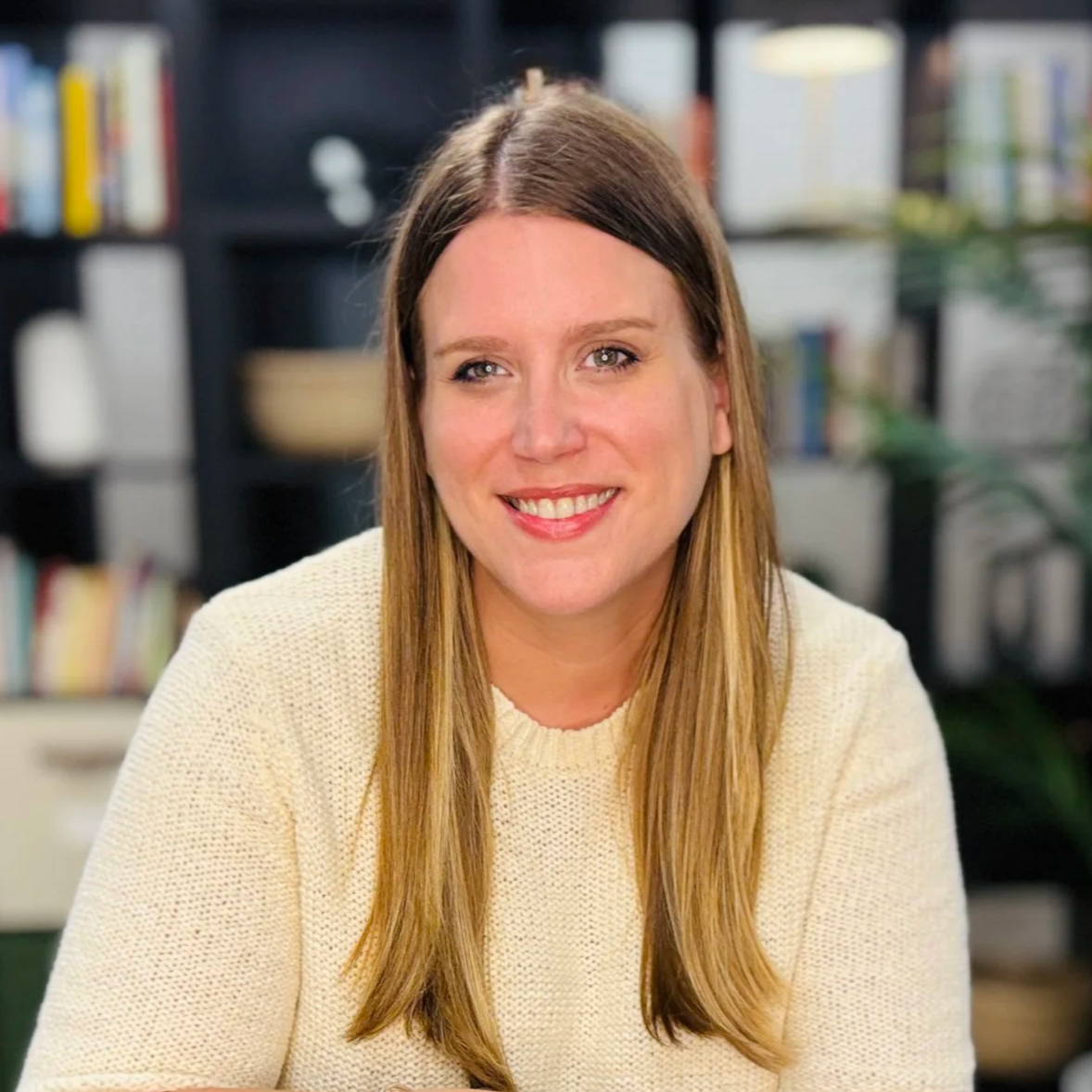 Founder of Thrively Co., Shannon Theobald, sitting in her in-person counseling office in Parsippany, NJ