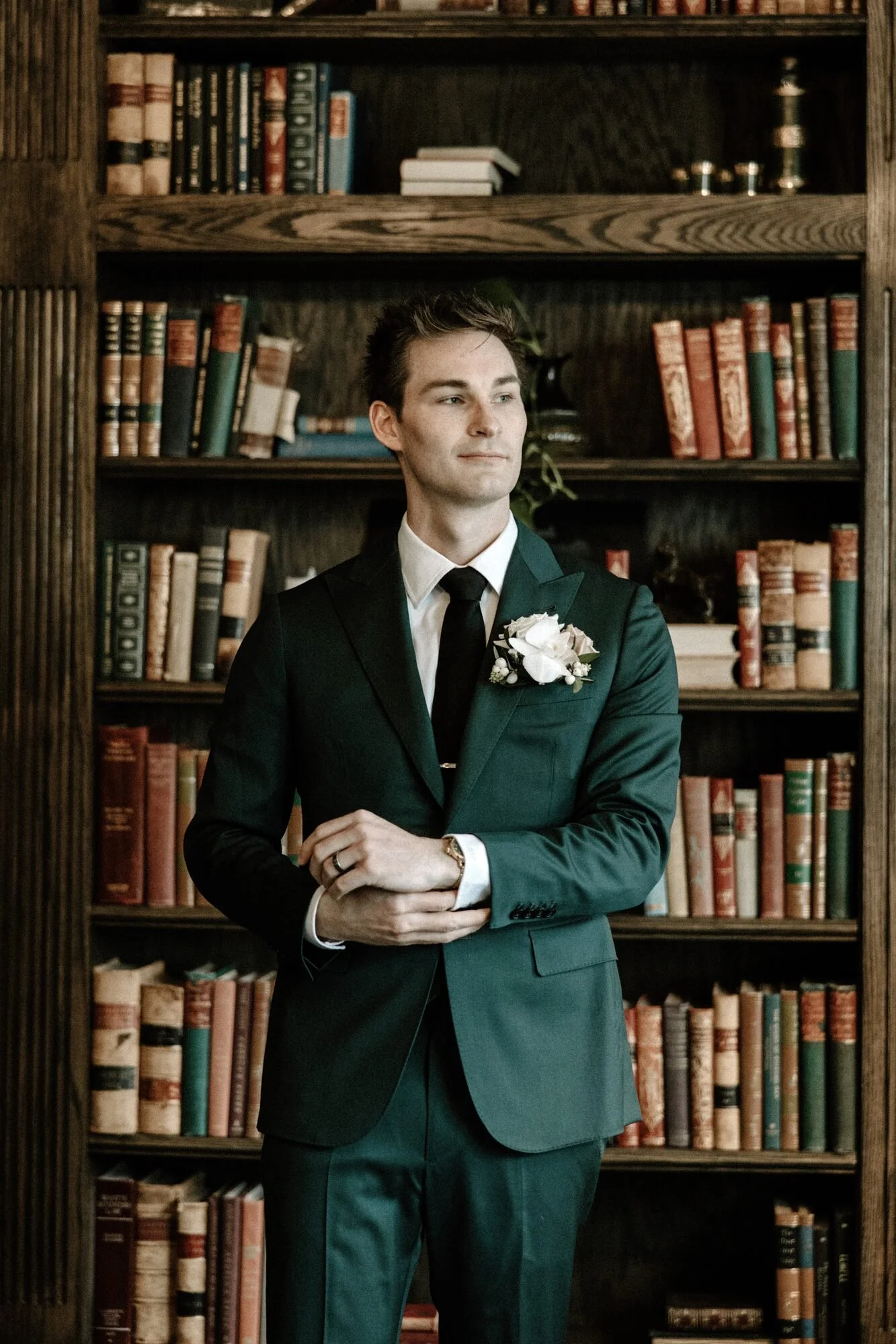 Client wearing a custom green wedding suit by Cuff & Crease in Denver
