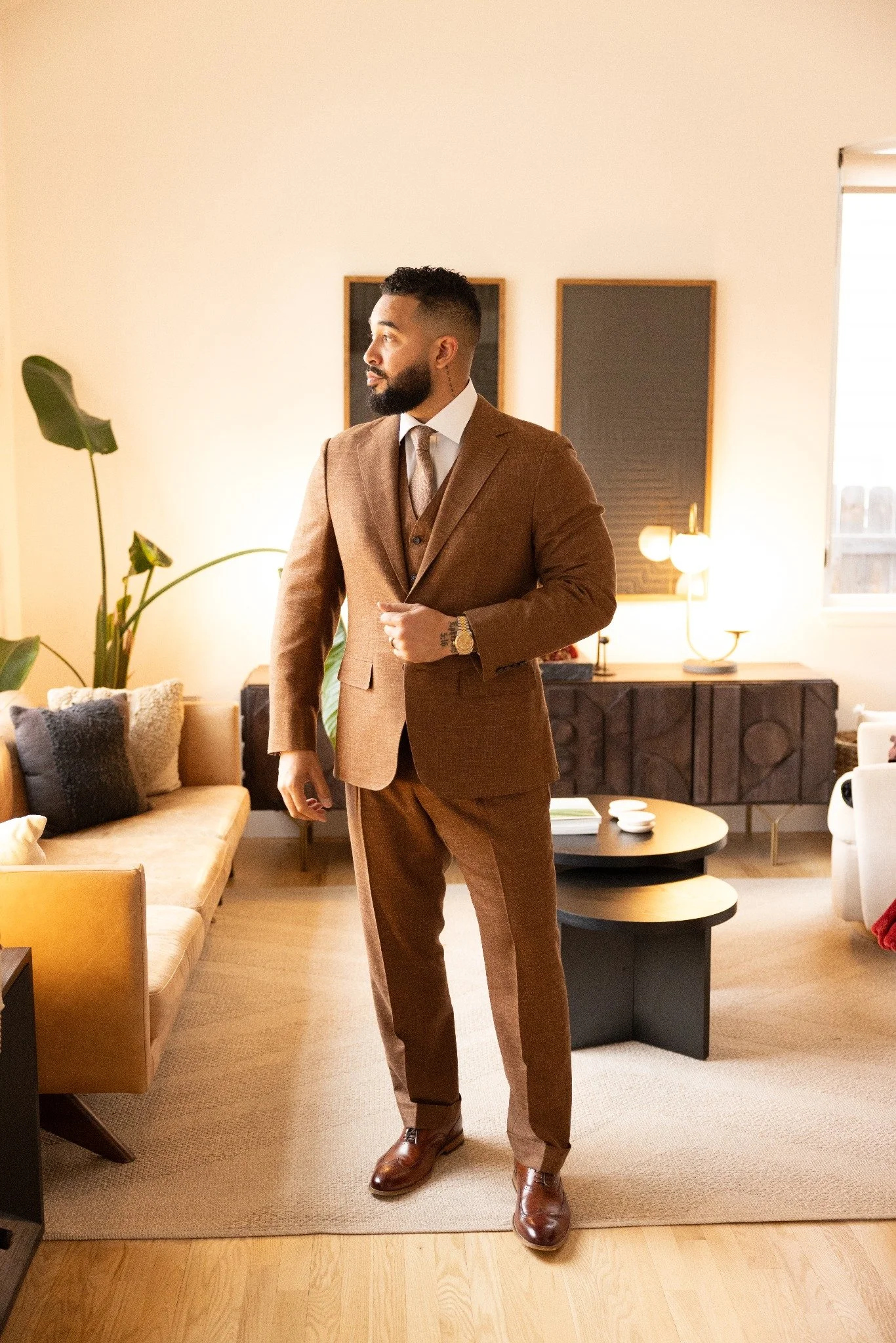 Cuff & Crease client in a brown three-piece bespoke suit with softly shaped shoulders and draped trousers.