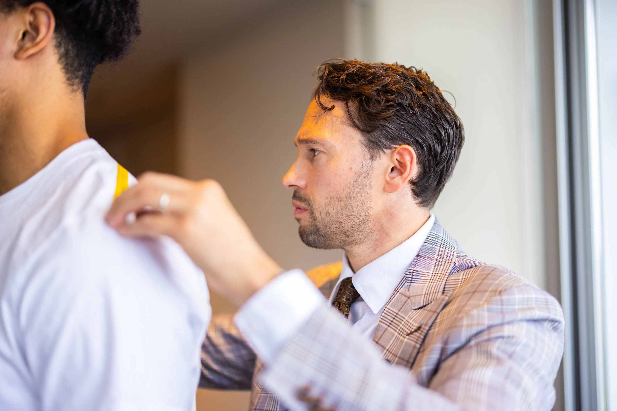 Private fitting for a custom shirt and jacket at Cuff & Crease in Denver.