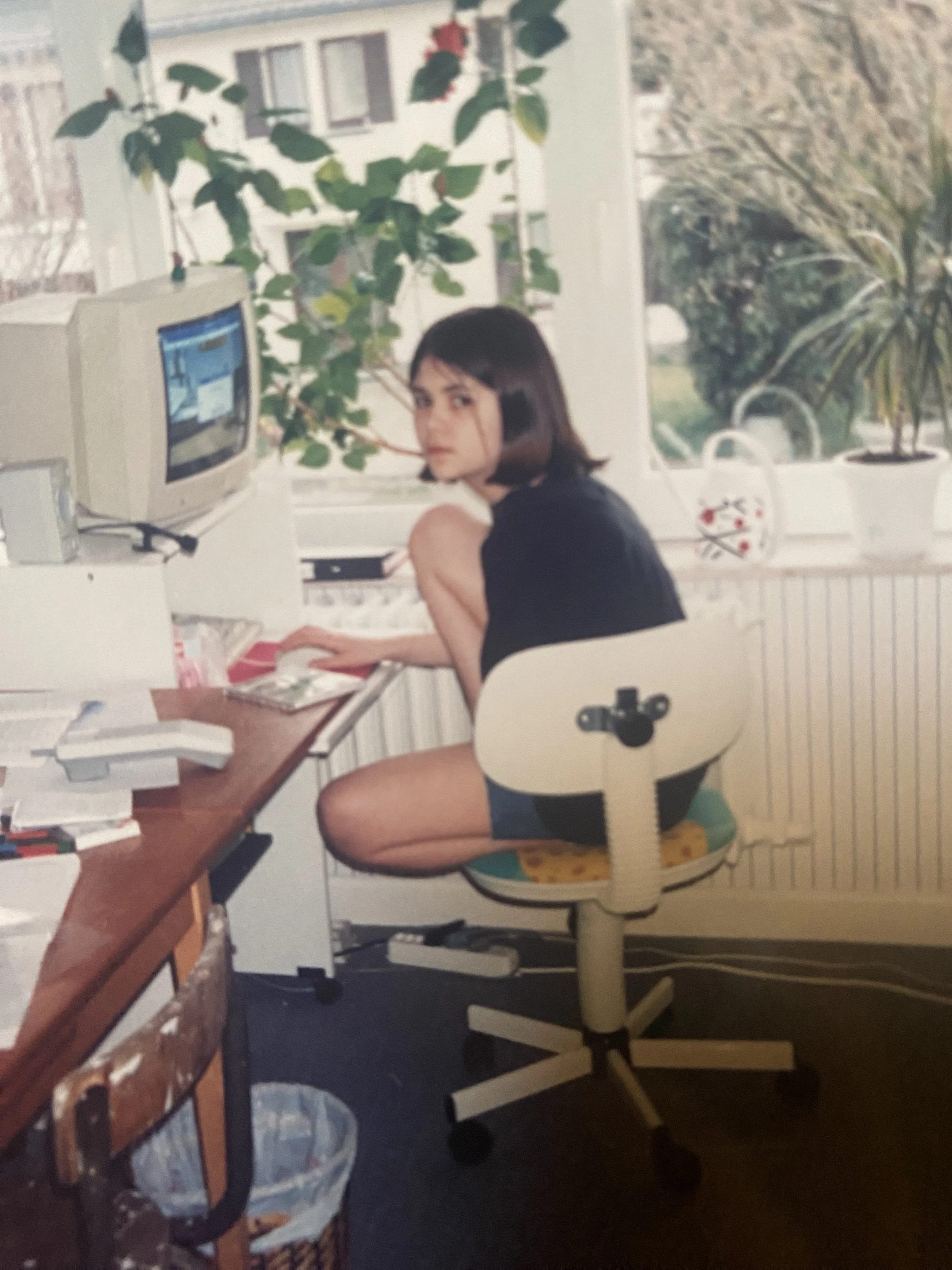 Sullen teen Linnea on her desktop computer