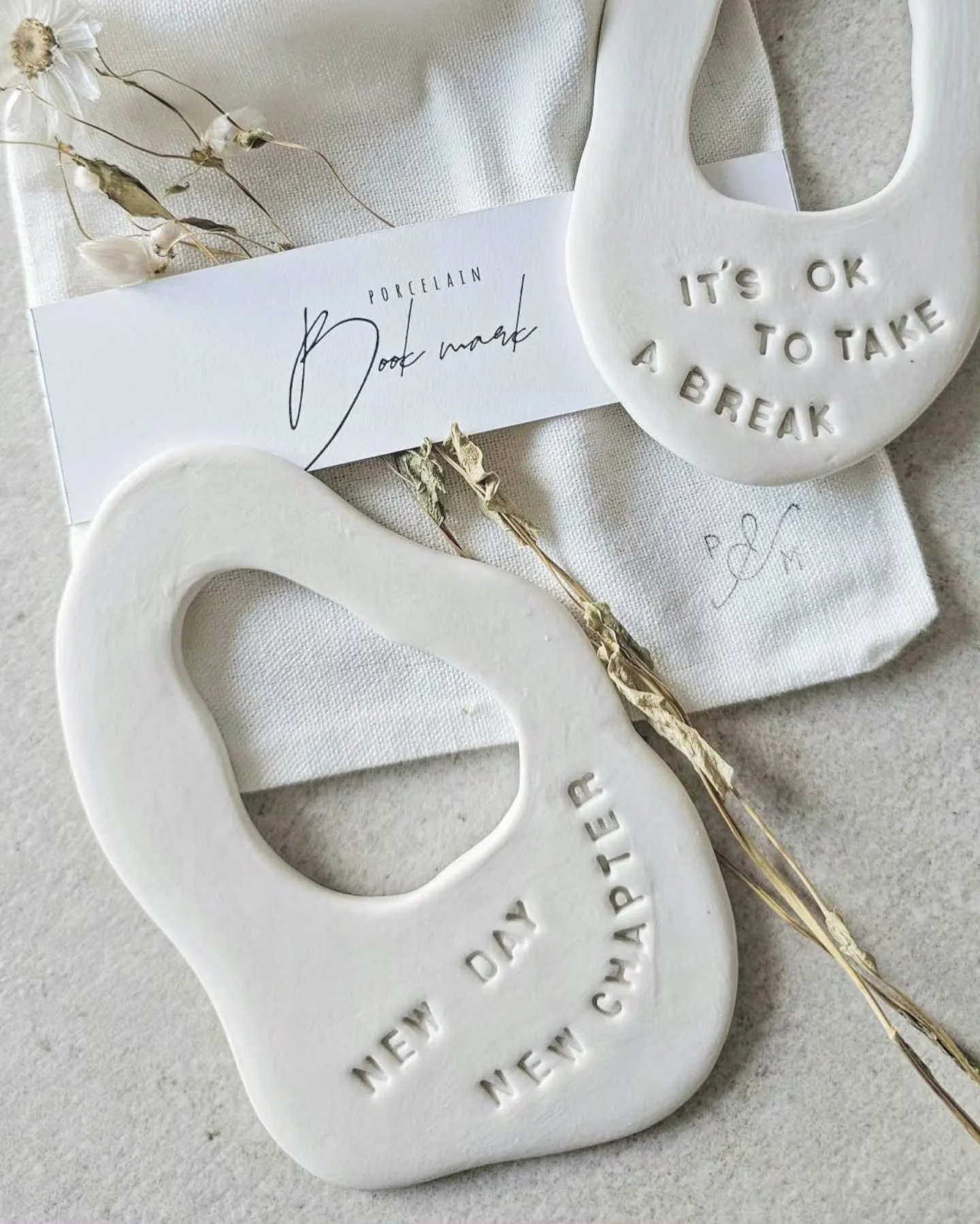A quiet companion for every story.
 
These handmade porcelain bookmarks are crafted with care&mdash;each one shaped, fired, and finished by hand to create a delicate piece that feels as special as the pages it rests between.

Light, smooth, and timel