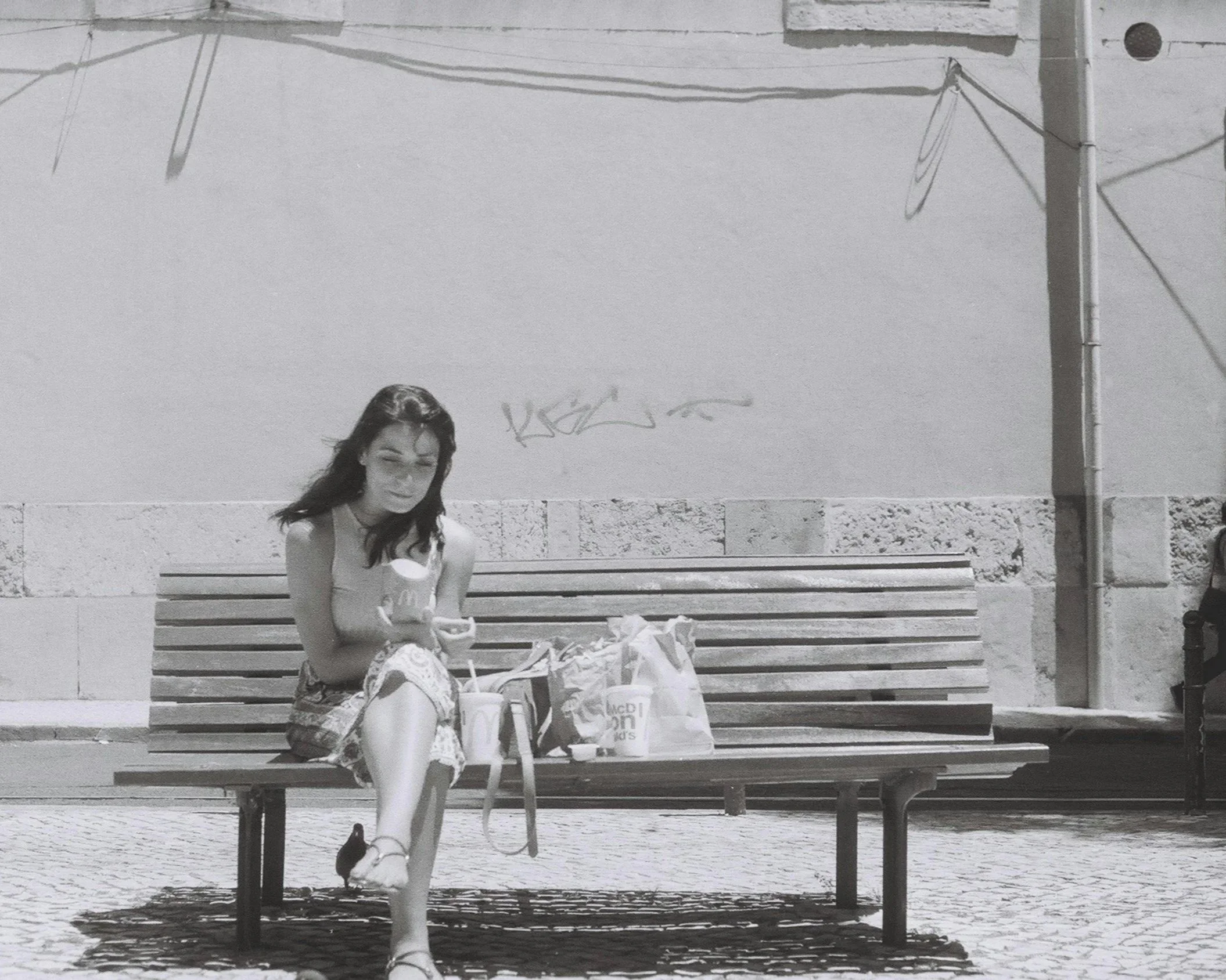 Person sitting alone on a bench, suggesting loneliness and reflection