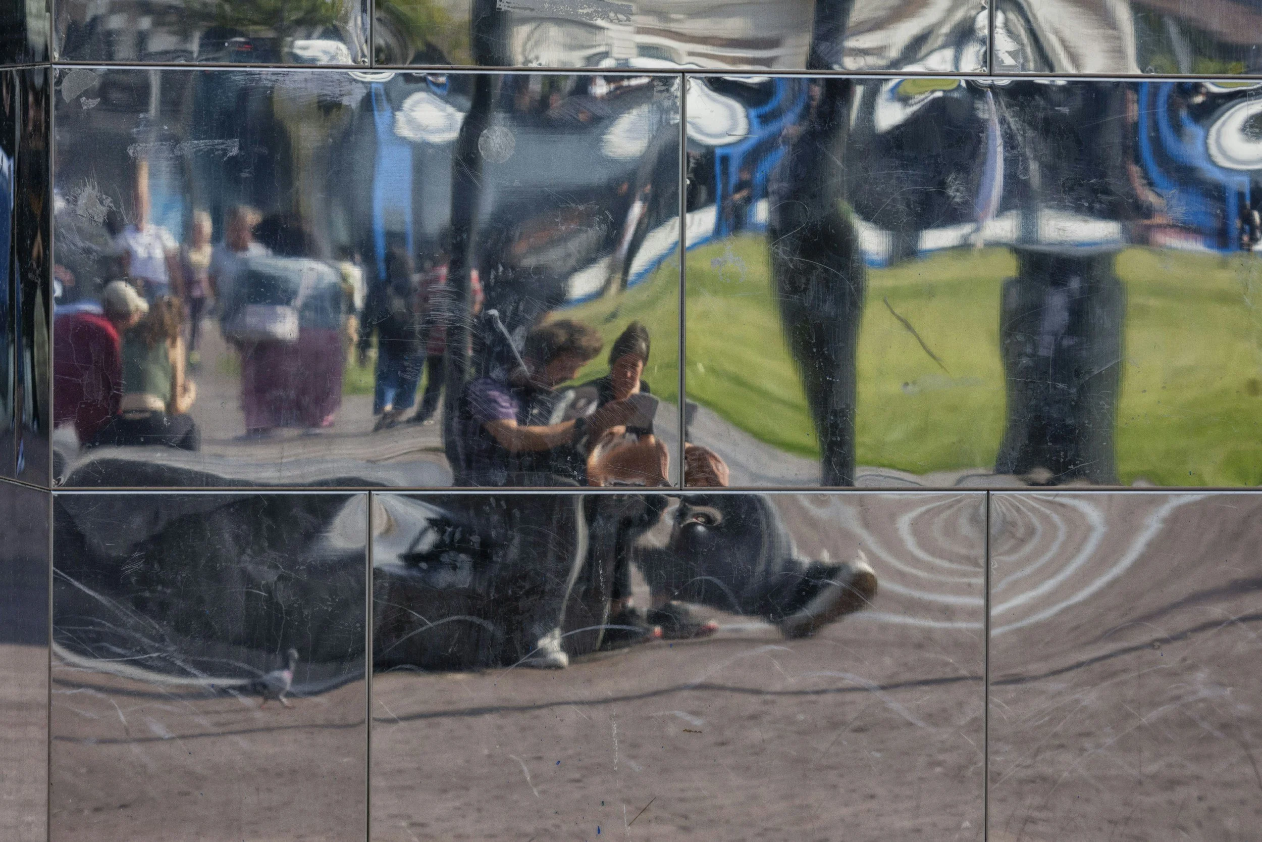 Fragmented mirror reflections of a couple sitting next to each other, symbolising confusion and distorted perception in gaslighting dynamics.
