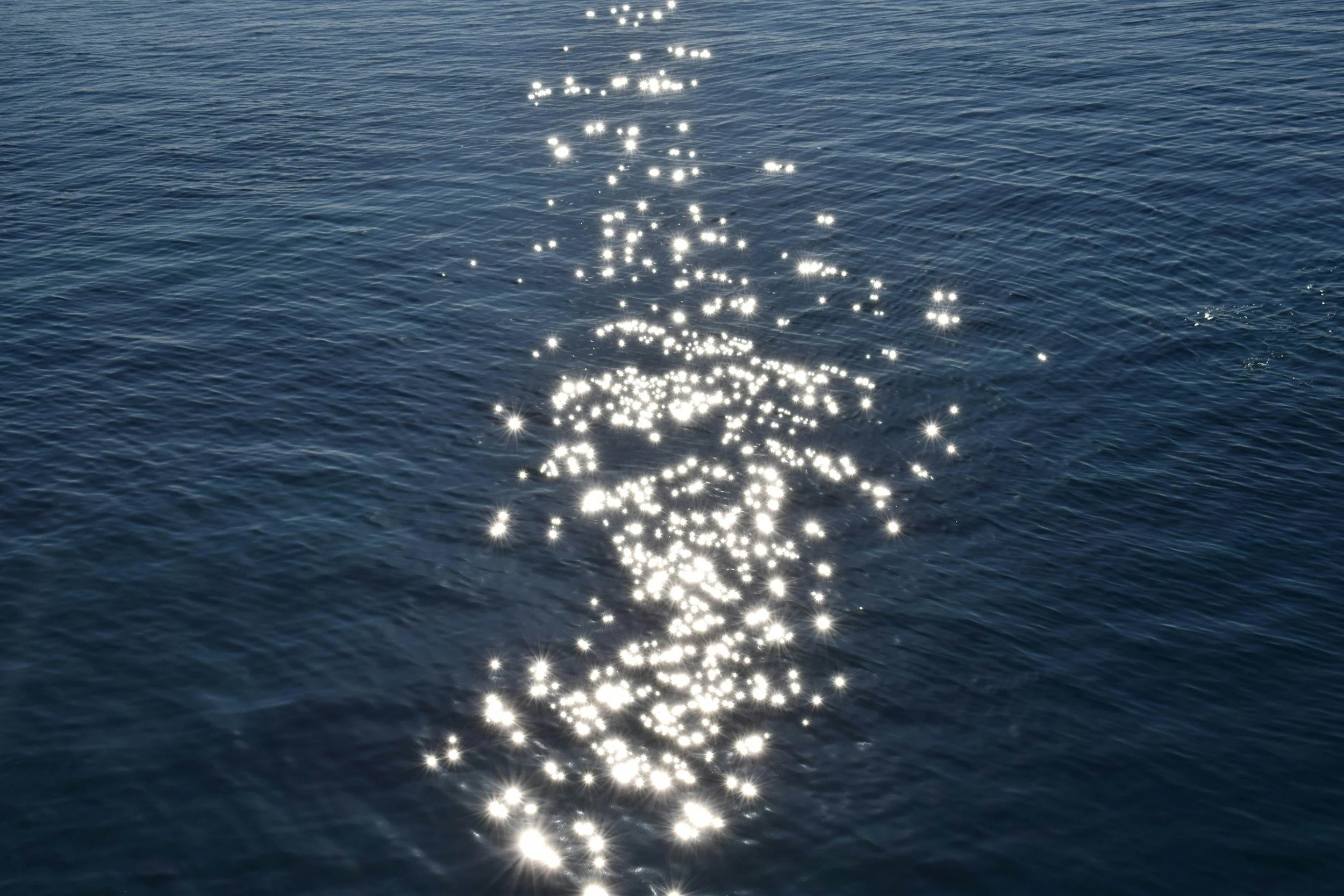 Light reflecting on water, evoking stillness and distance