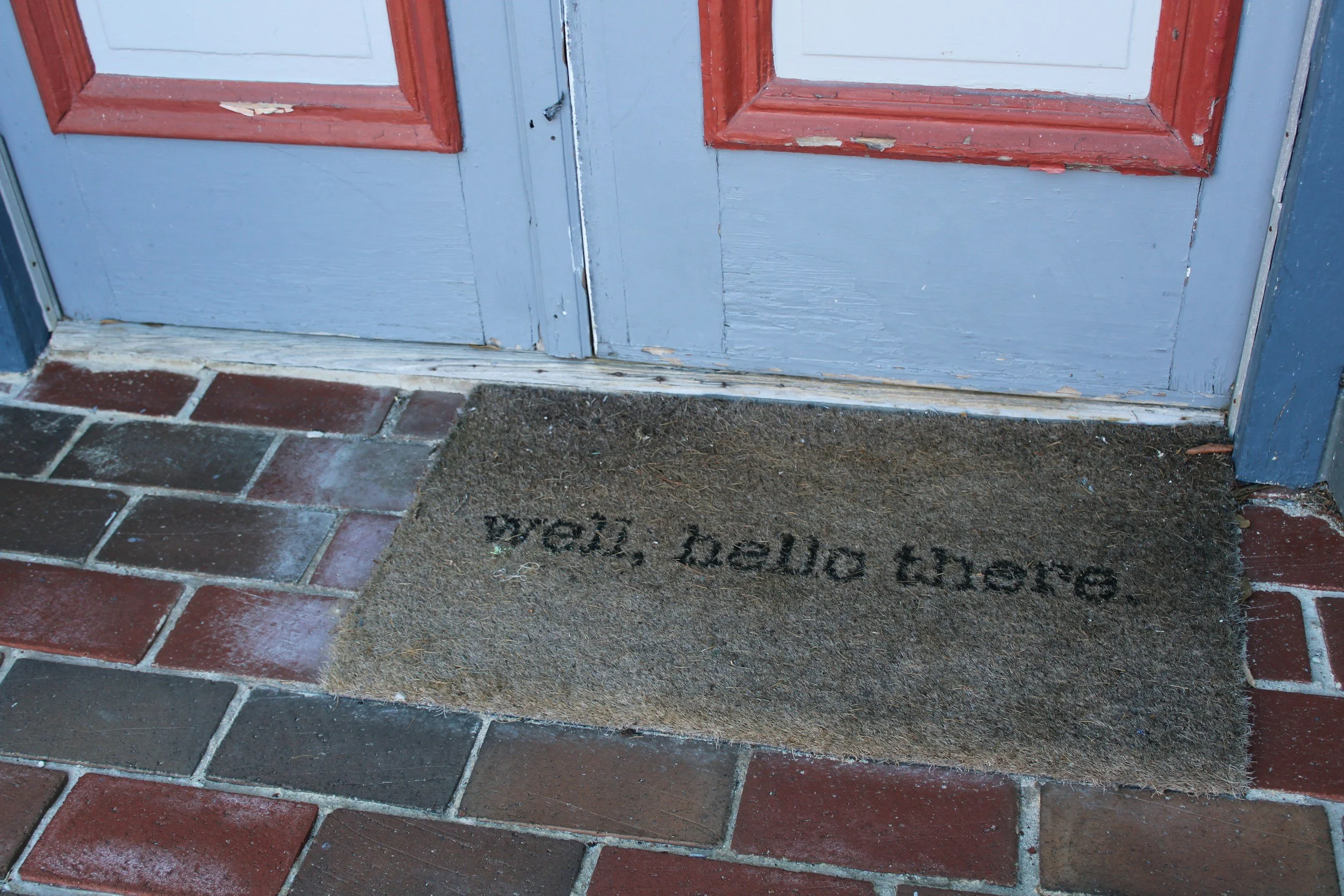 Doormat reading “well, hello there”, representing awareness and self-reflection in relationships