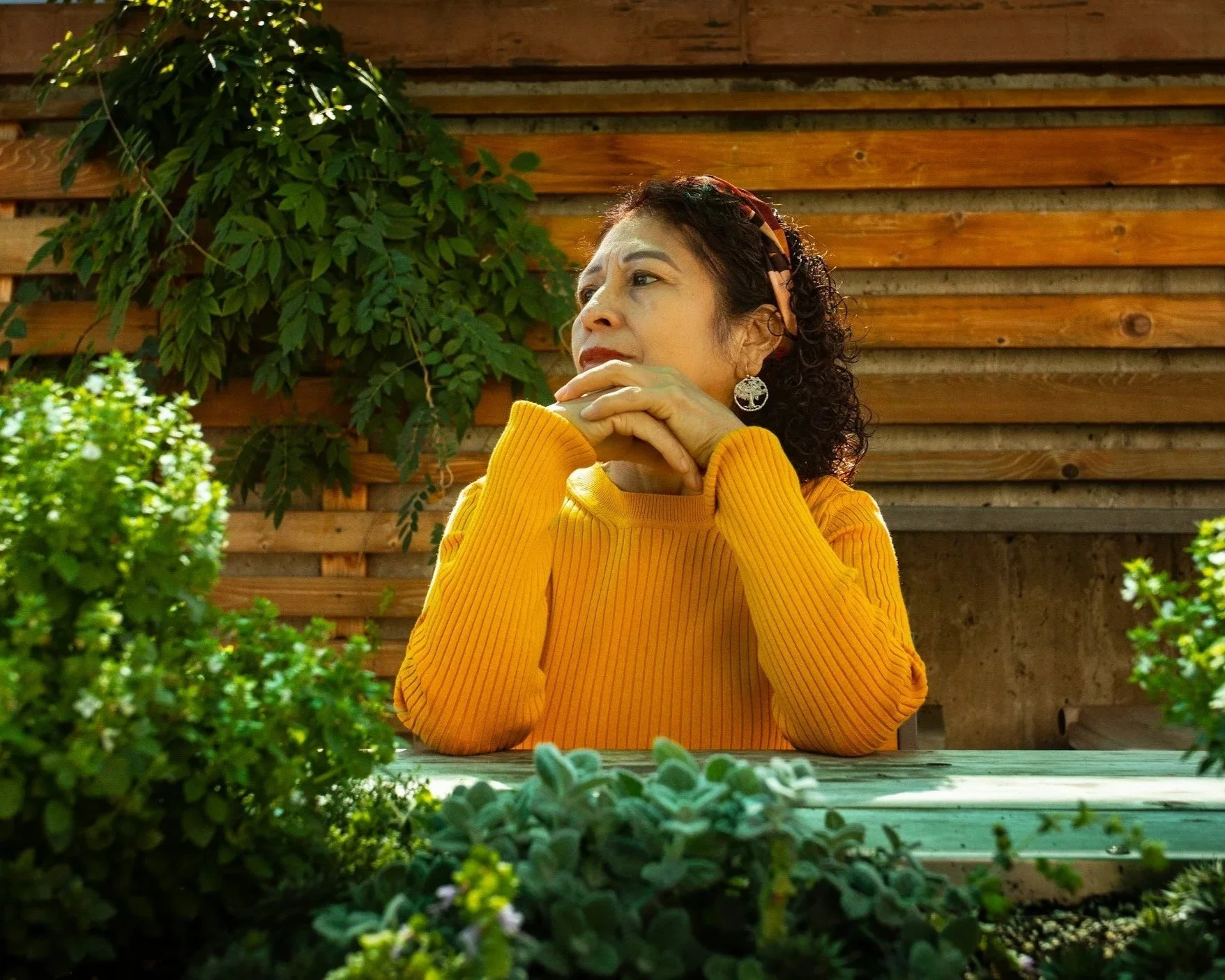 Woman reflecting alone outdoors, representing grief, estrangement, and the emotional impact of trauma on parent–adult child relationships.