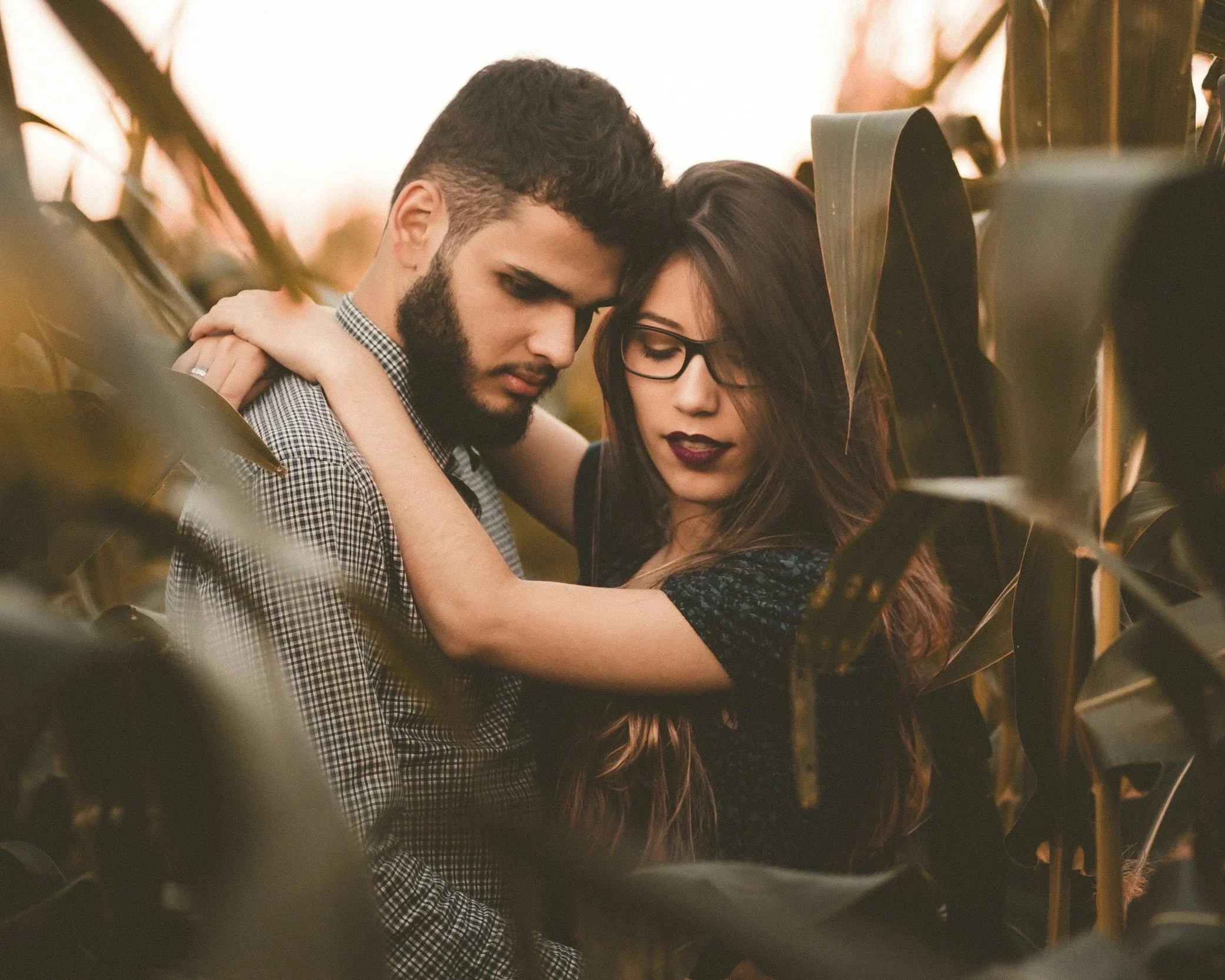 Couple standing closely together, representing emotional intensity and unavailable love