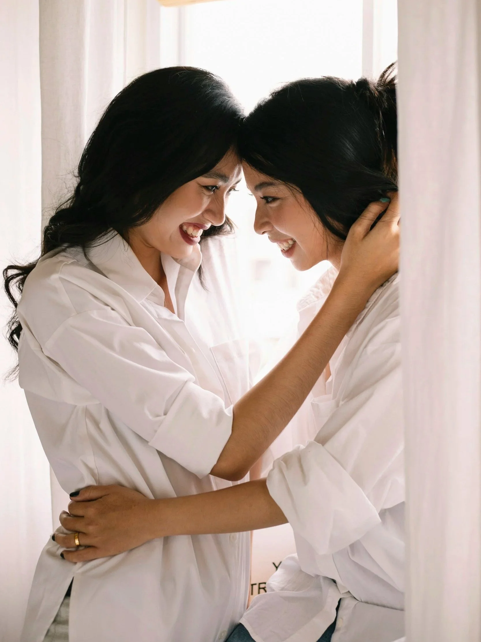 Two people holding each other closely, representing emotional closeness mixed with anxiety