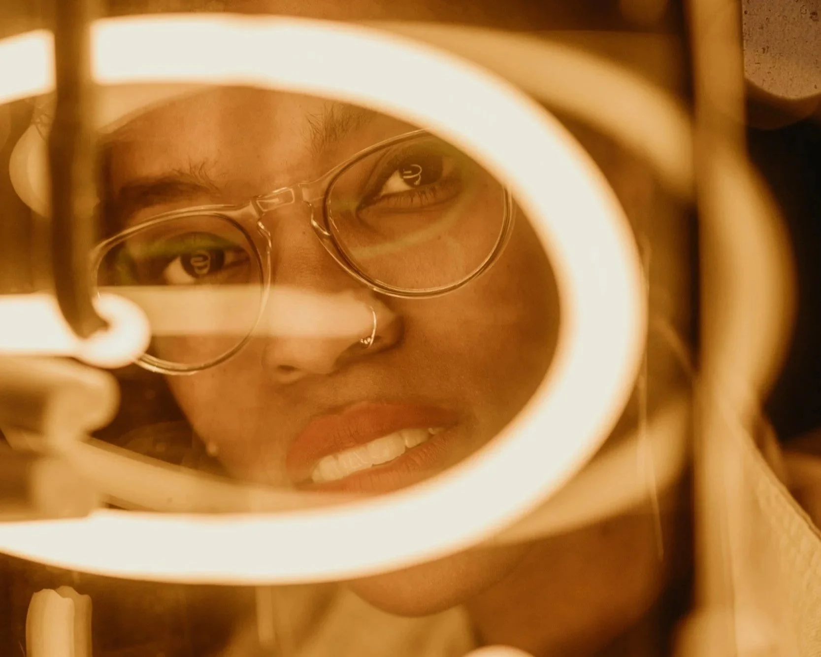 Person looking at their reflection through a distorted surface