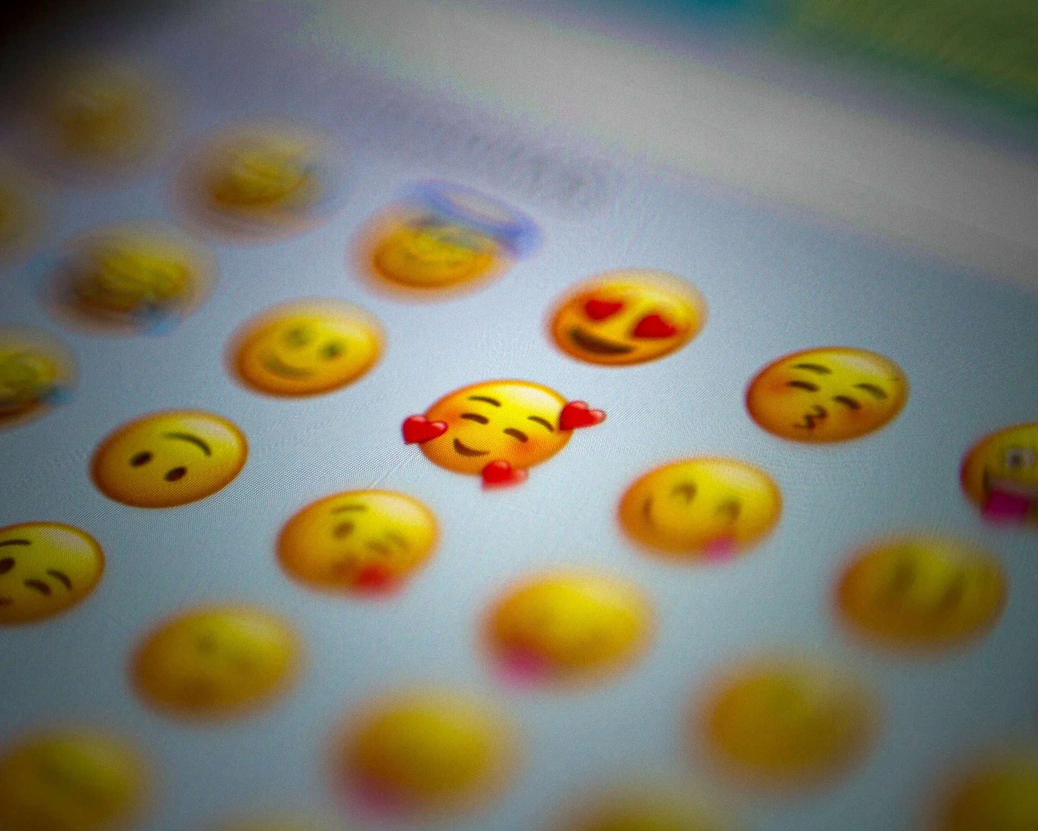 Emoji reactions on a phone screen, representing mixed signals and intermittent attention