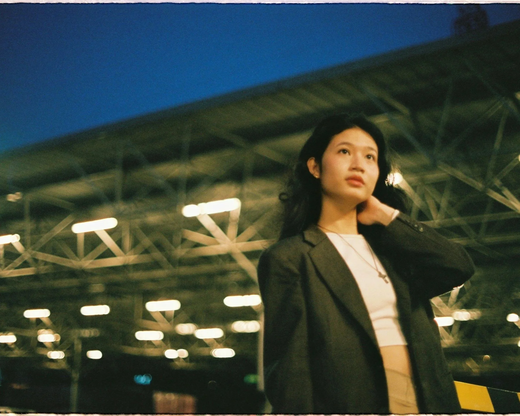 Professional woman standing alone in a public space