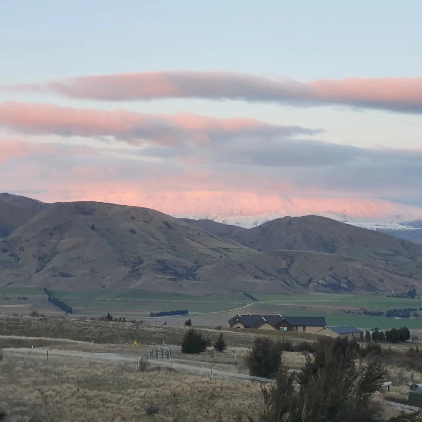 The sun went down the moon goes and the light lid pink on the mountains