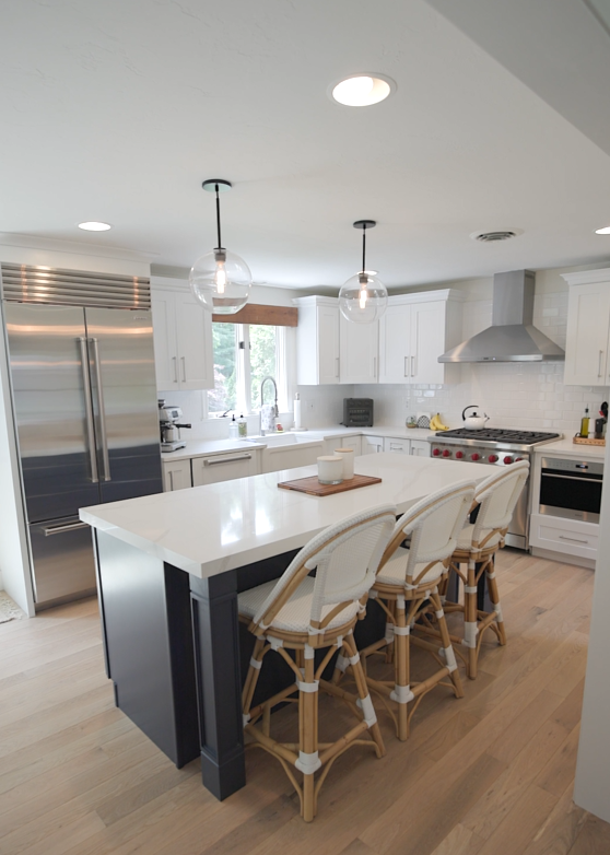 Custom kitchen remodel by MSDG Construction in Kingston, MA — island, cabinetry, and quartz countertops
