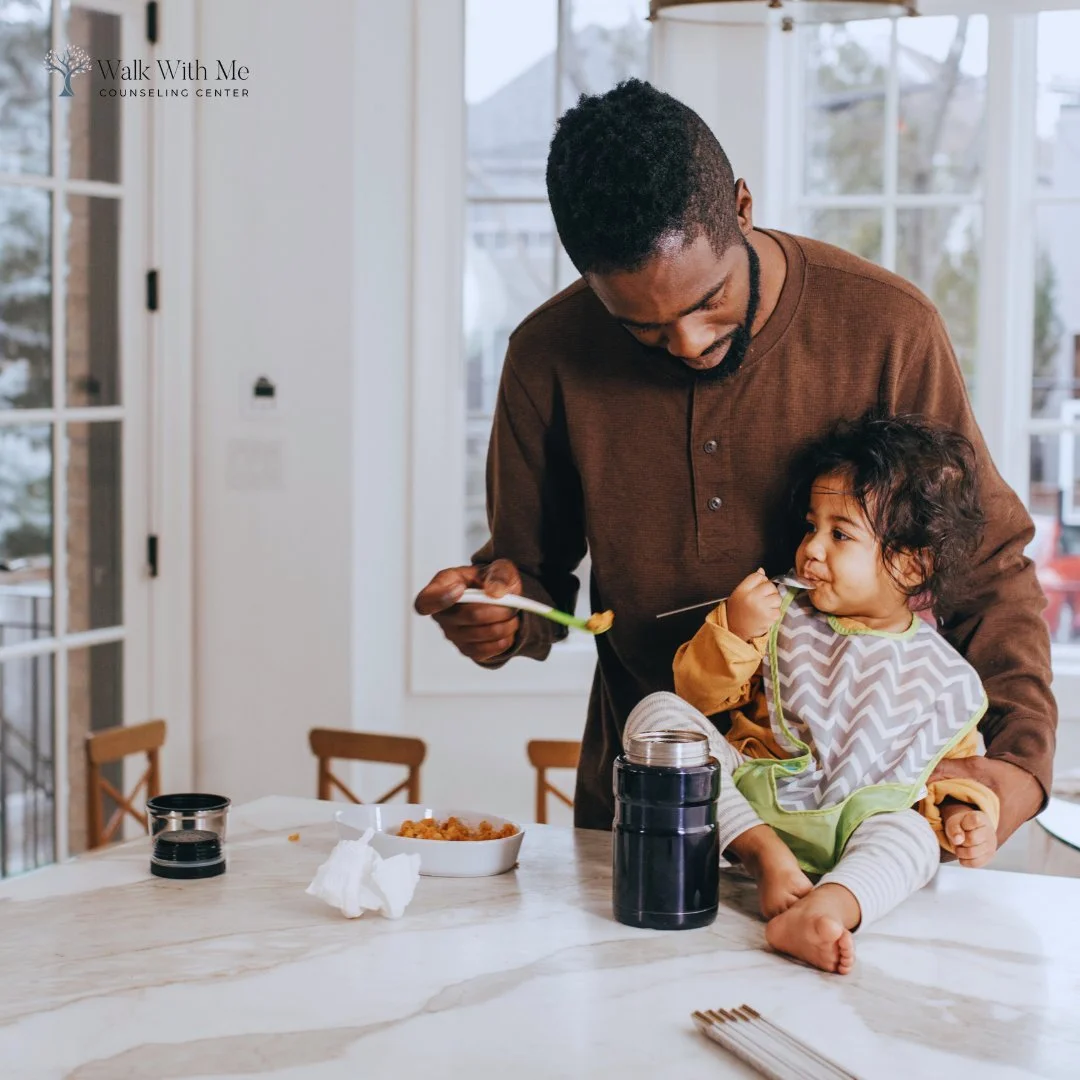 A father feeding his child