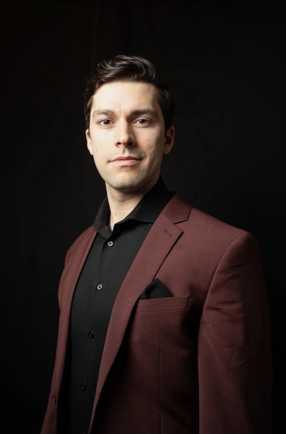 Sterling Cozza, Music Director of St. John's Park Slope, in a burgundy jacket