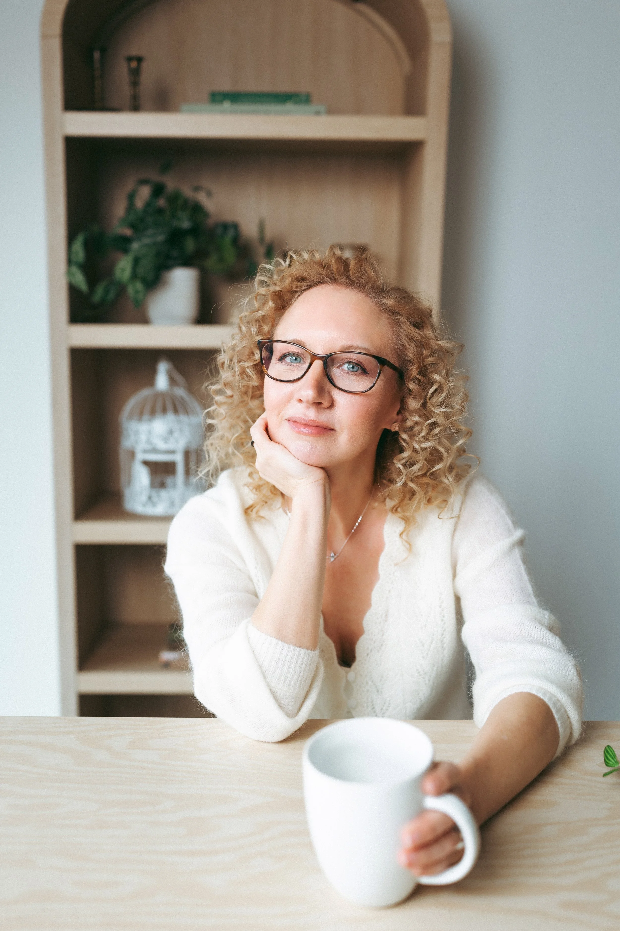 Image of Rebecca Danzenbaker author holding a coffee mug