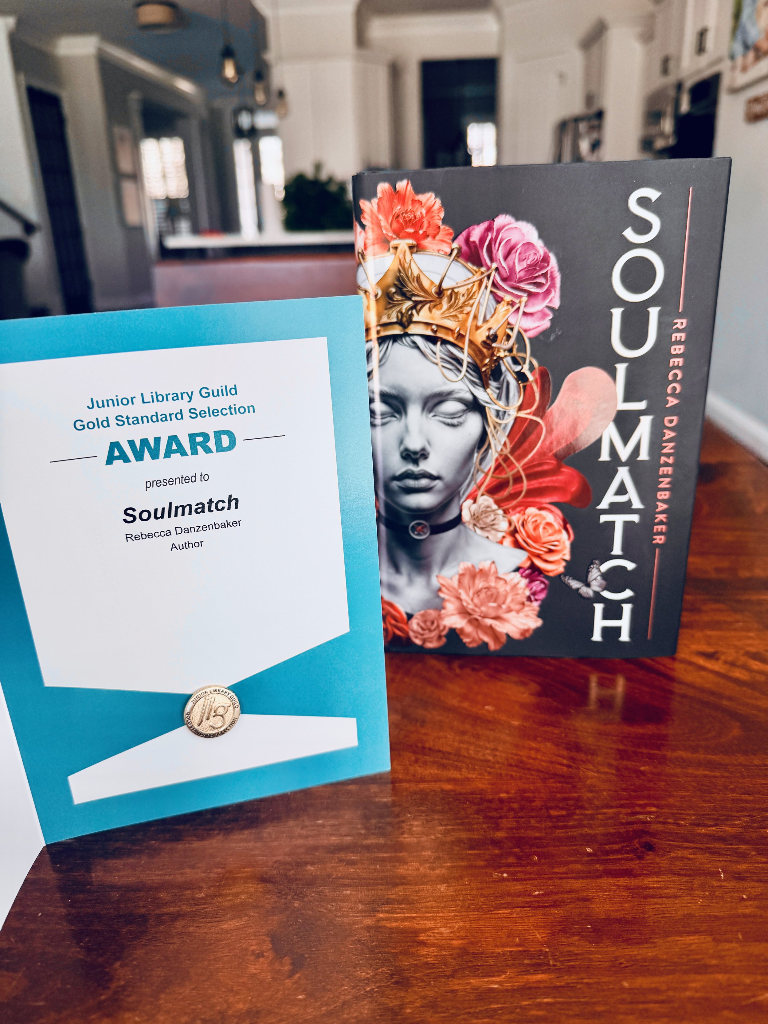 Rebecca Danzenbaker's Soulmatch received Junior Library Guild Gold Standard certificate and pin