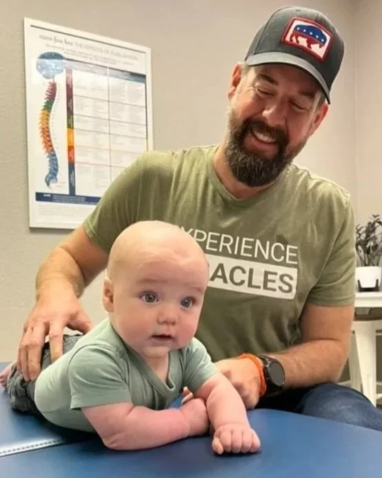 Gentle pediatric chiropractic adjustment focused on infant nervous system regulation