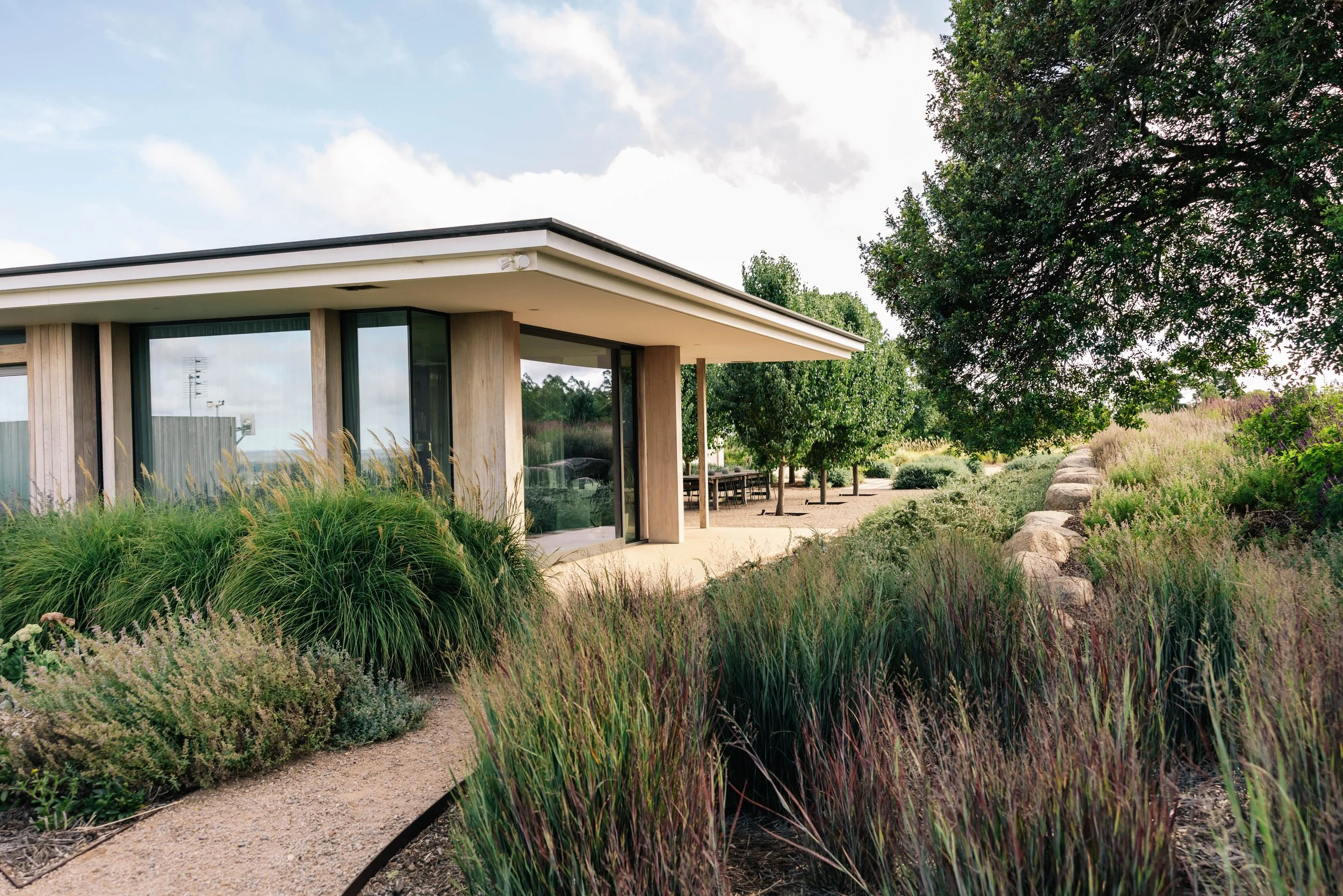 garden design, landscape design, country garden, naturalistic garden, perennials, modern architecture, rock wall, gravel path, miscanthus