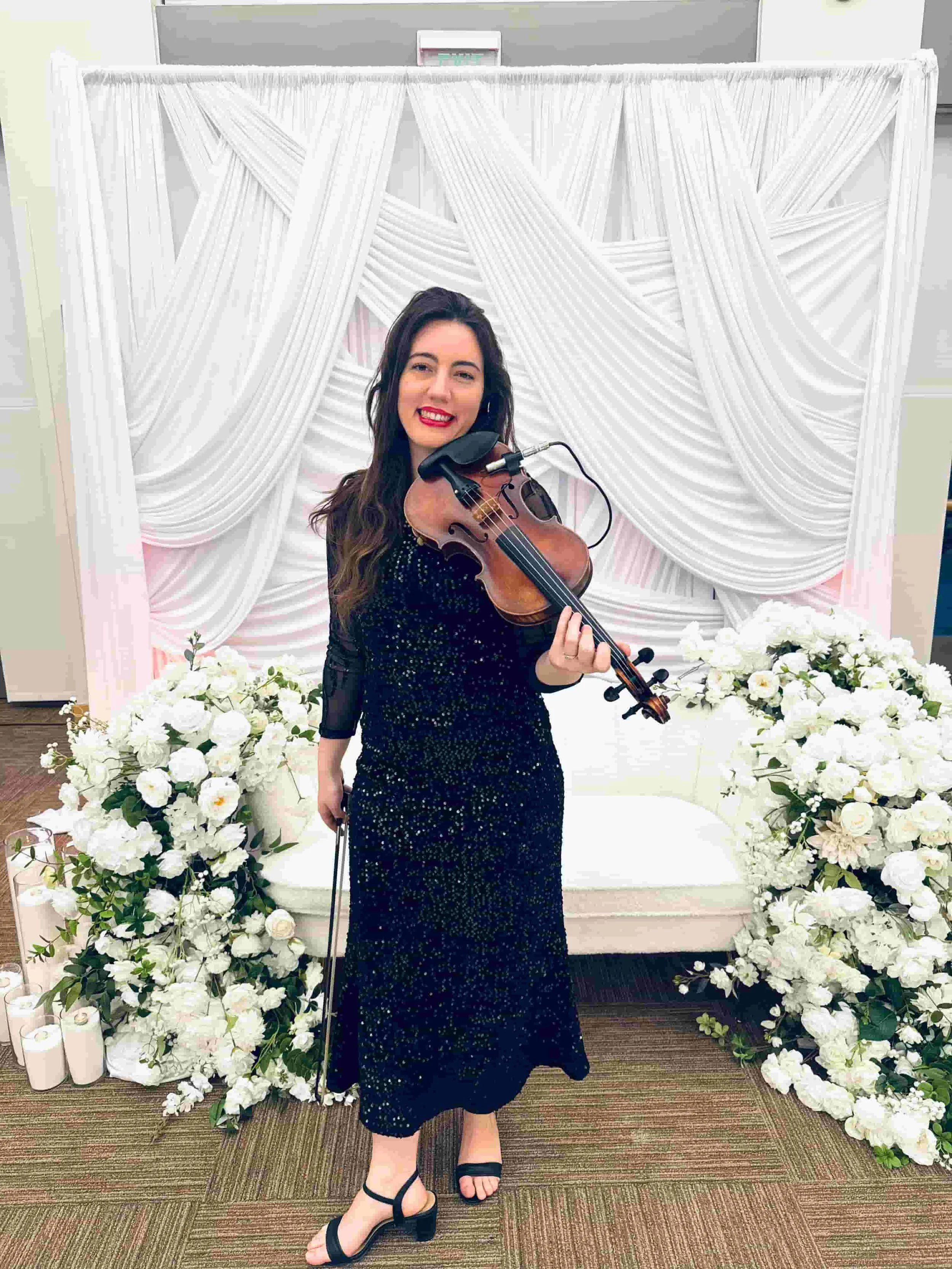 elegant violinist playing during wedding reception in LA