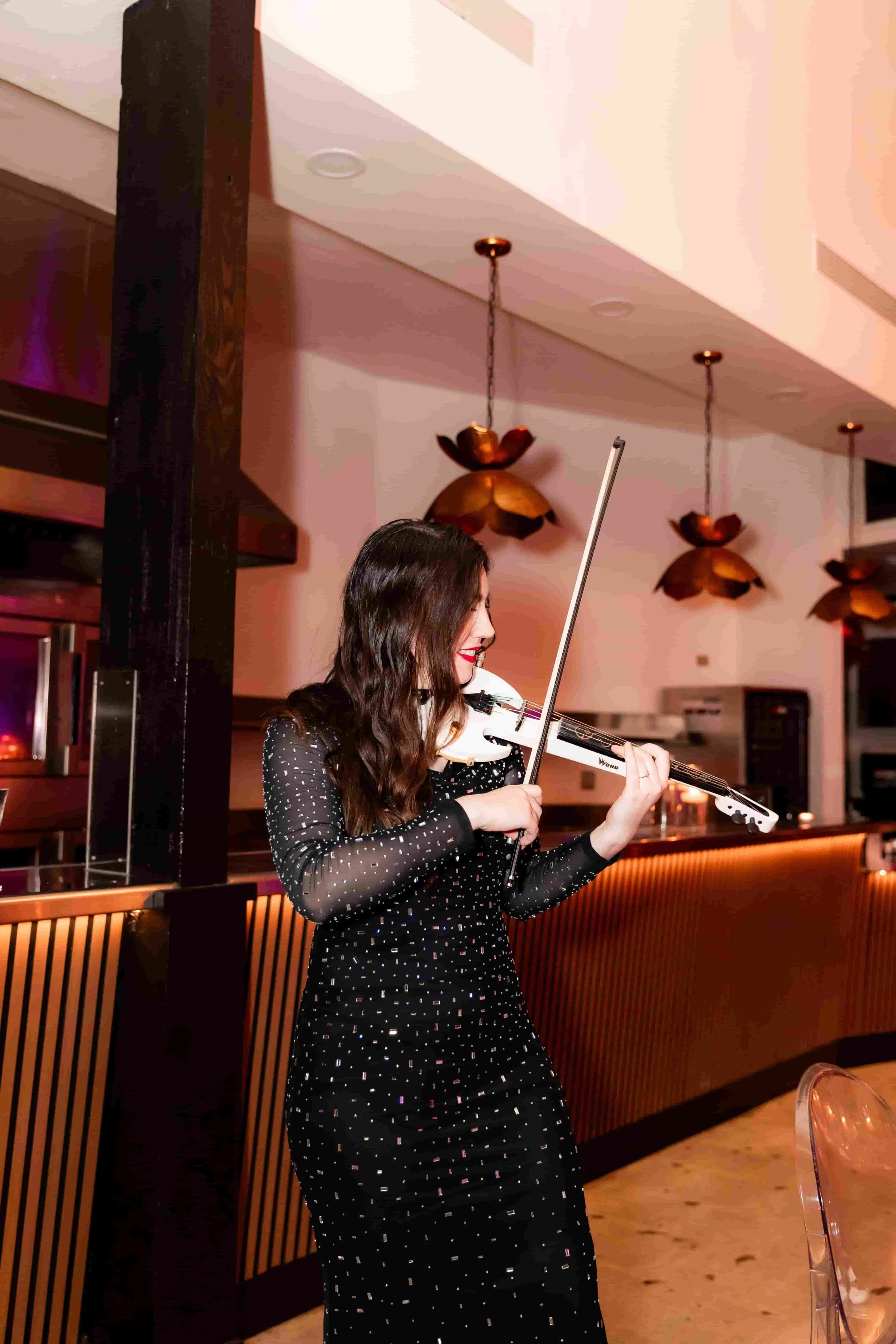 electric violinist performing at a luxury corporate event in Los Angeles