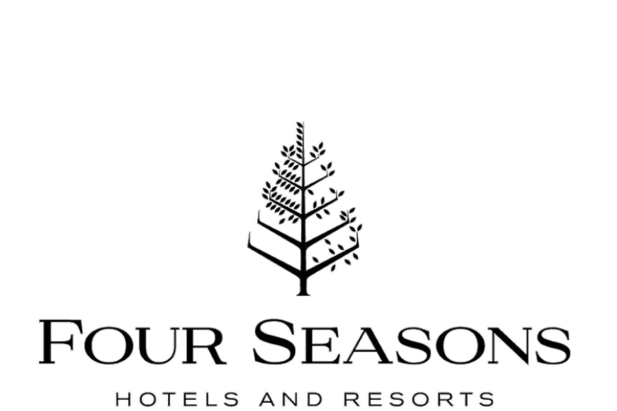 Logo for Four Seasons Hotels and Resorts, featuring a stylized evergreen tree and the company name.
