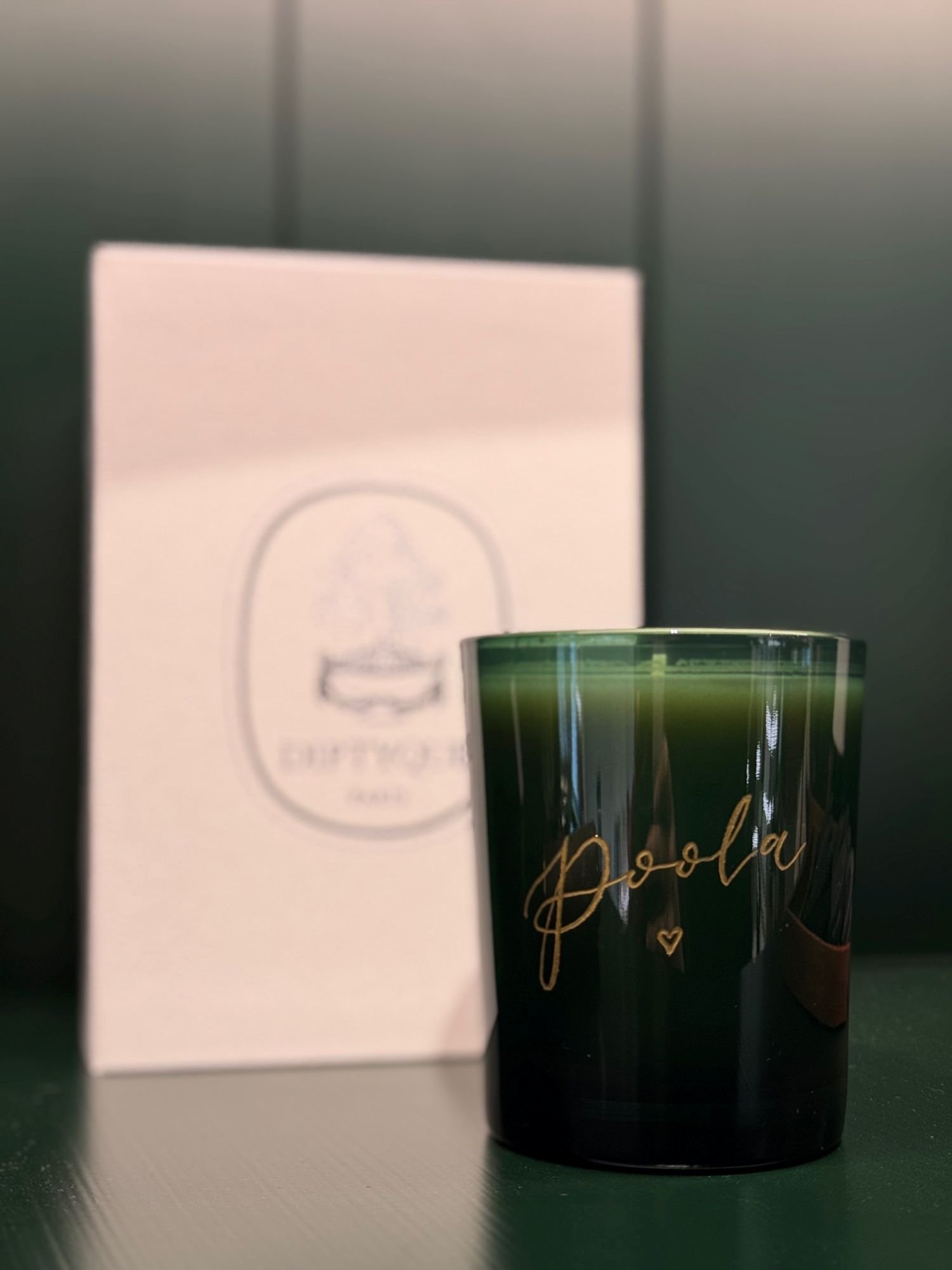 Engraved candle on a shelf