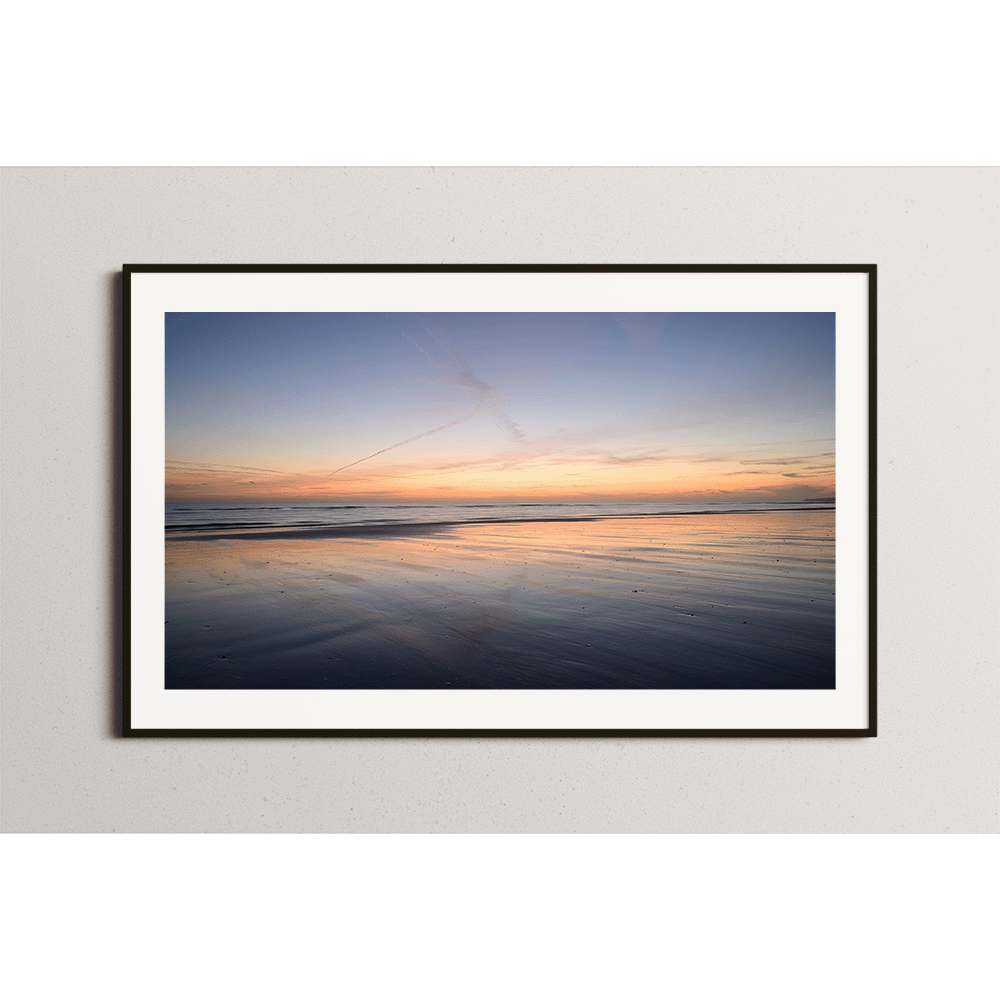 Sunset mirrored on the sand