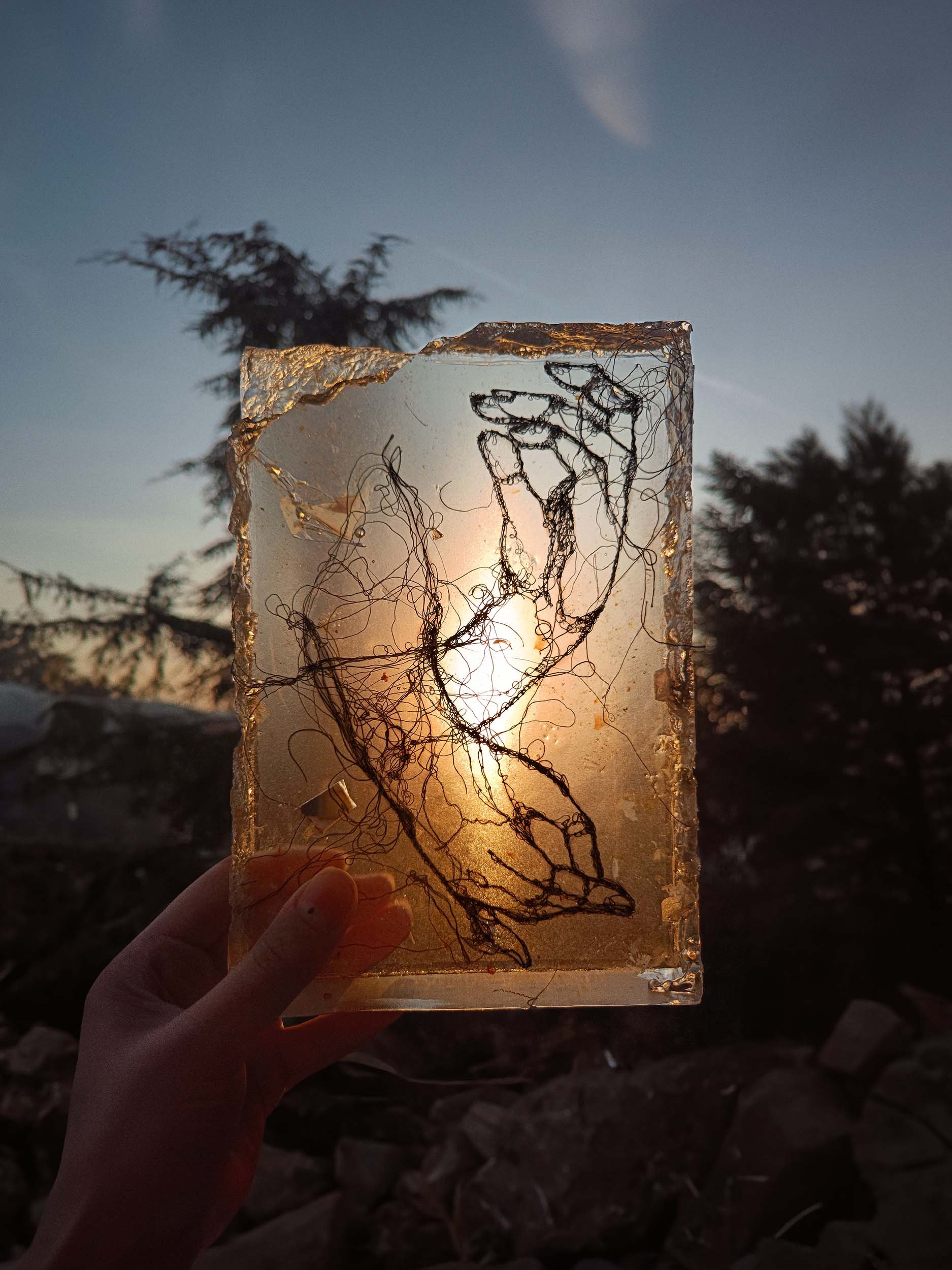 Sculpted epoxy resin with embedded cotton thread embroidery