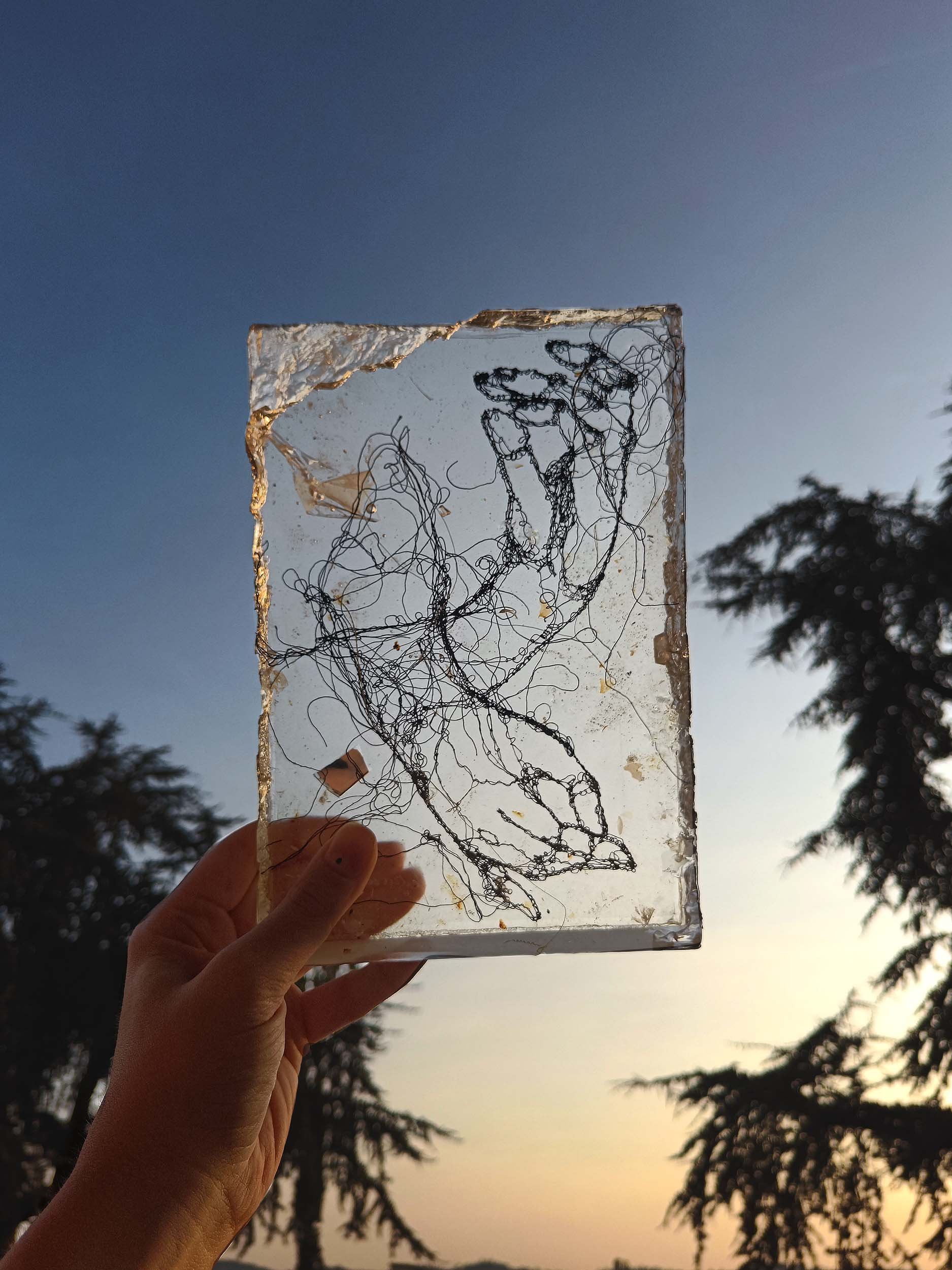 Sculpted epoxy resin with embedded cotton thread embroidery