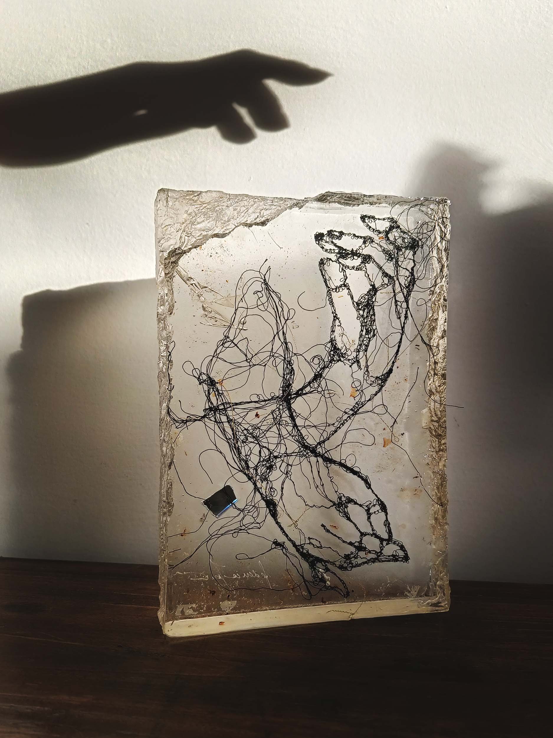 Sculpted epoxy resin with embedded cotton thread embroidery